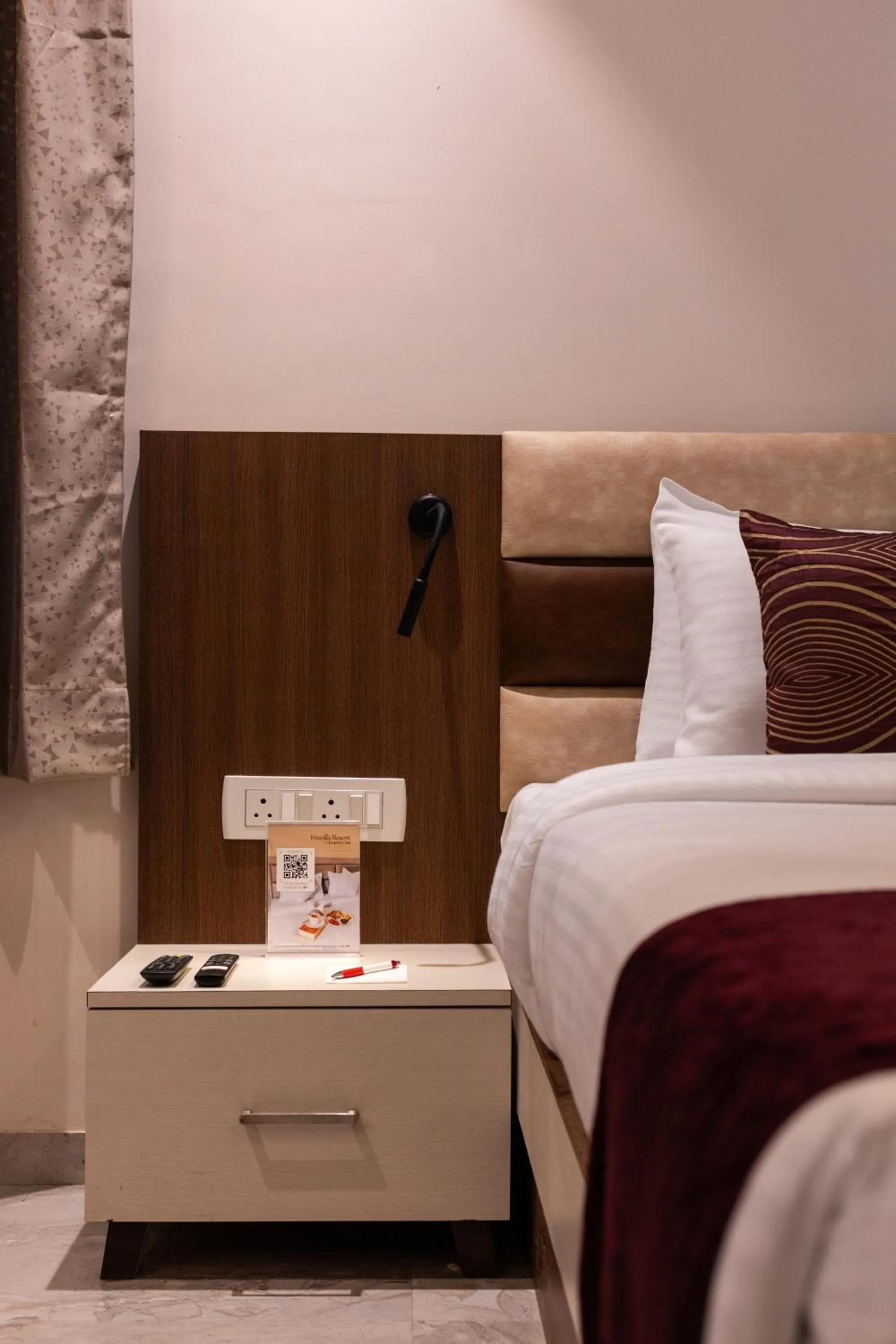 Bed in Freesia Resort by Express Inn