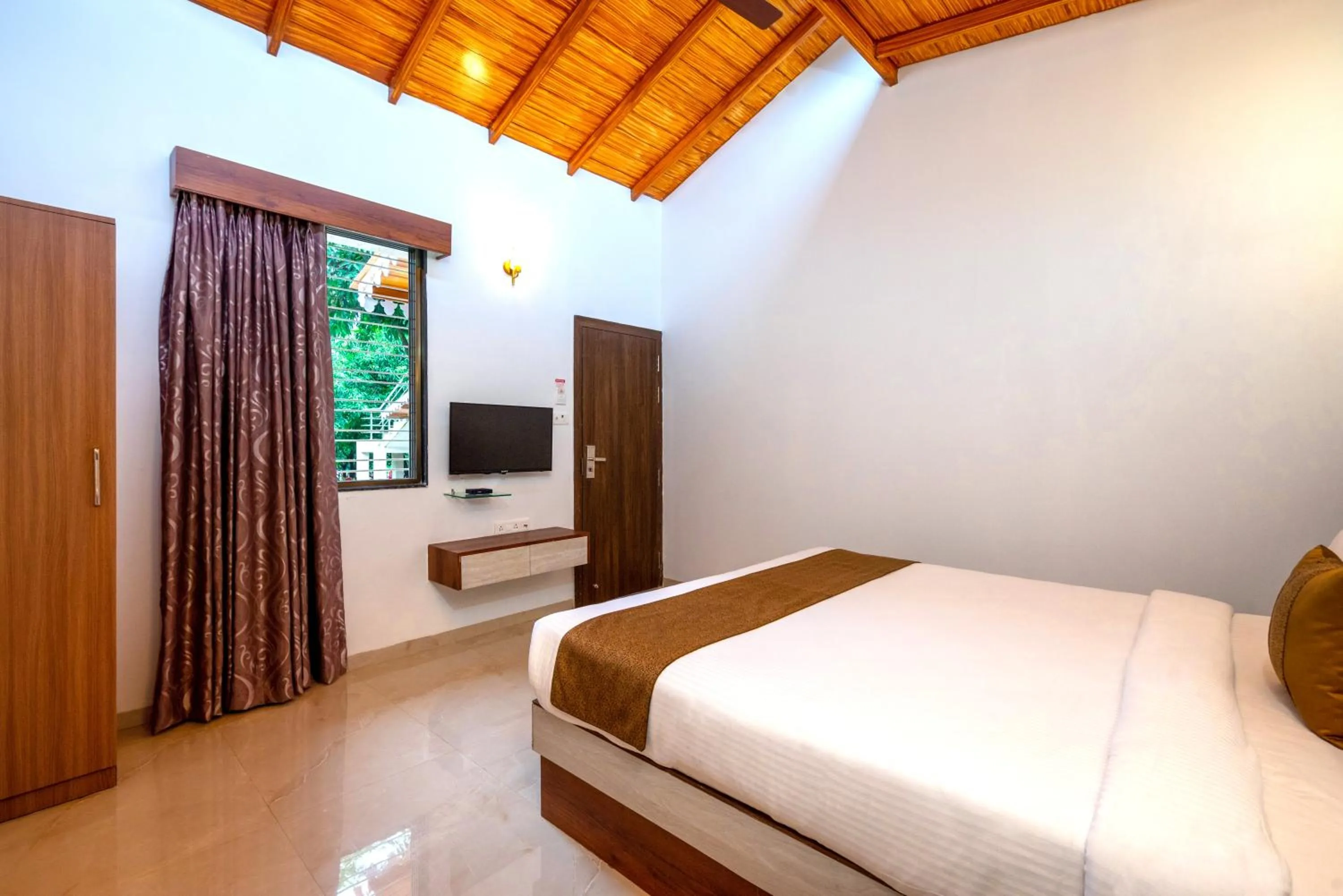 Bed in Freesia Resort by Express Inn