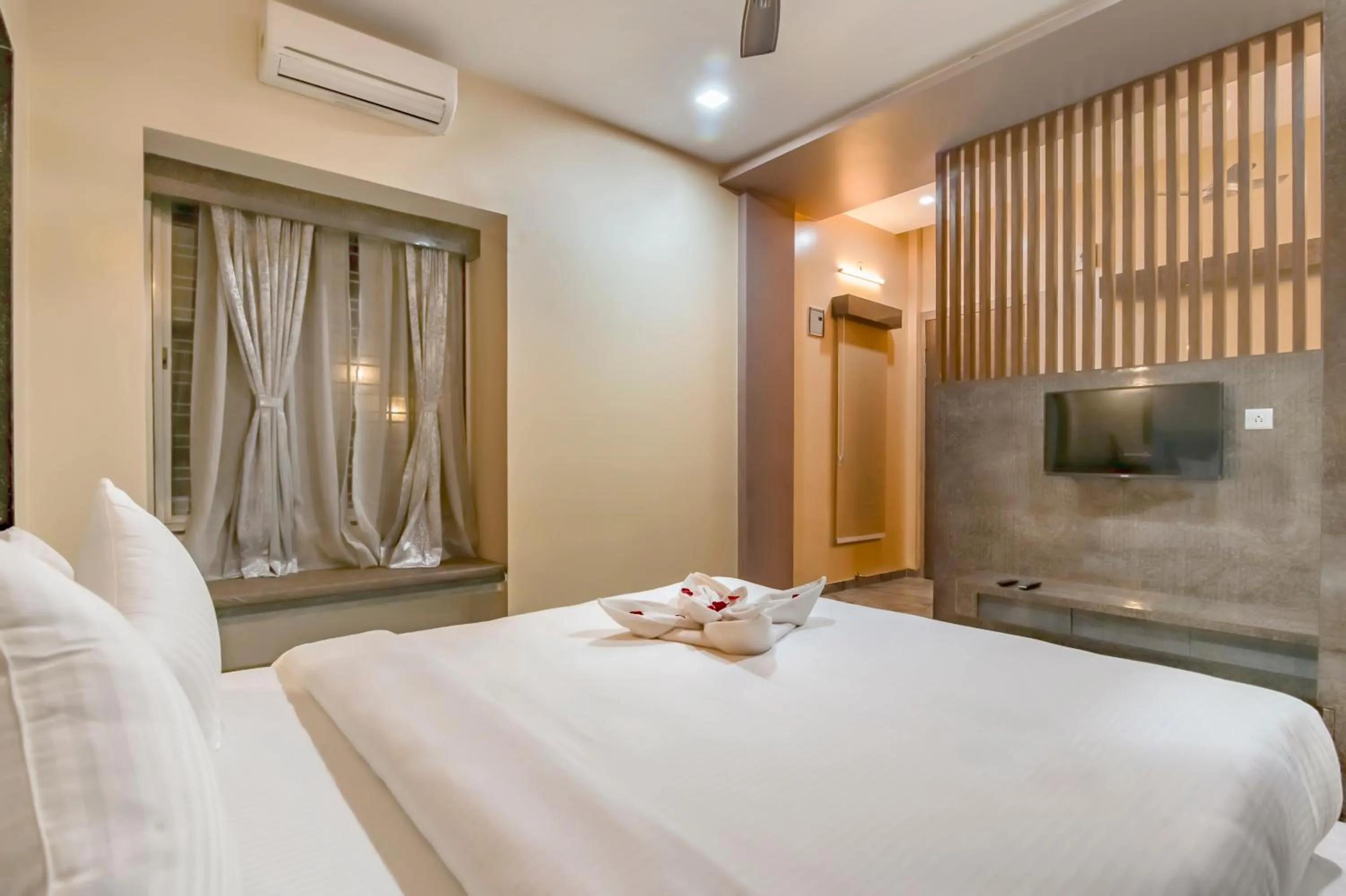 Bed in Freesia Resort by Express Inn