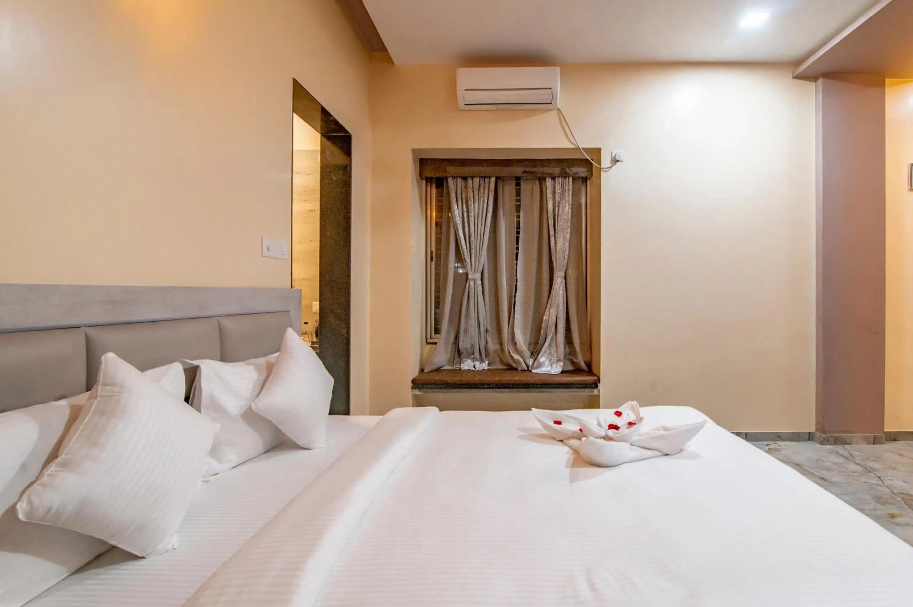 Bed in Freesia Resort by Express Inn