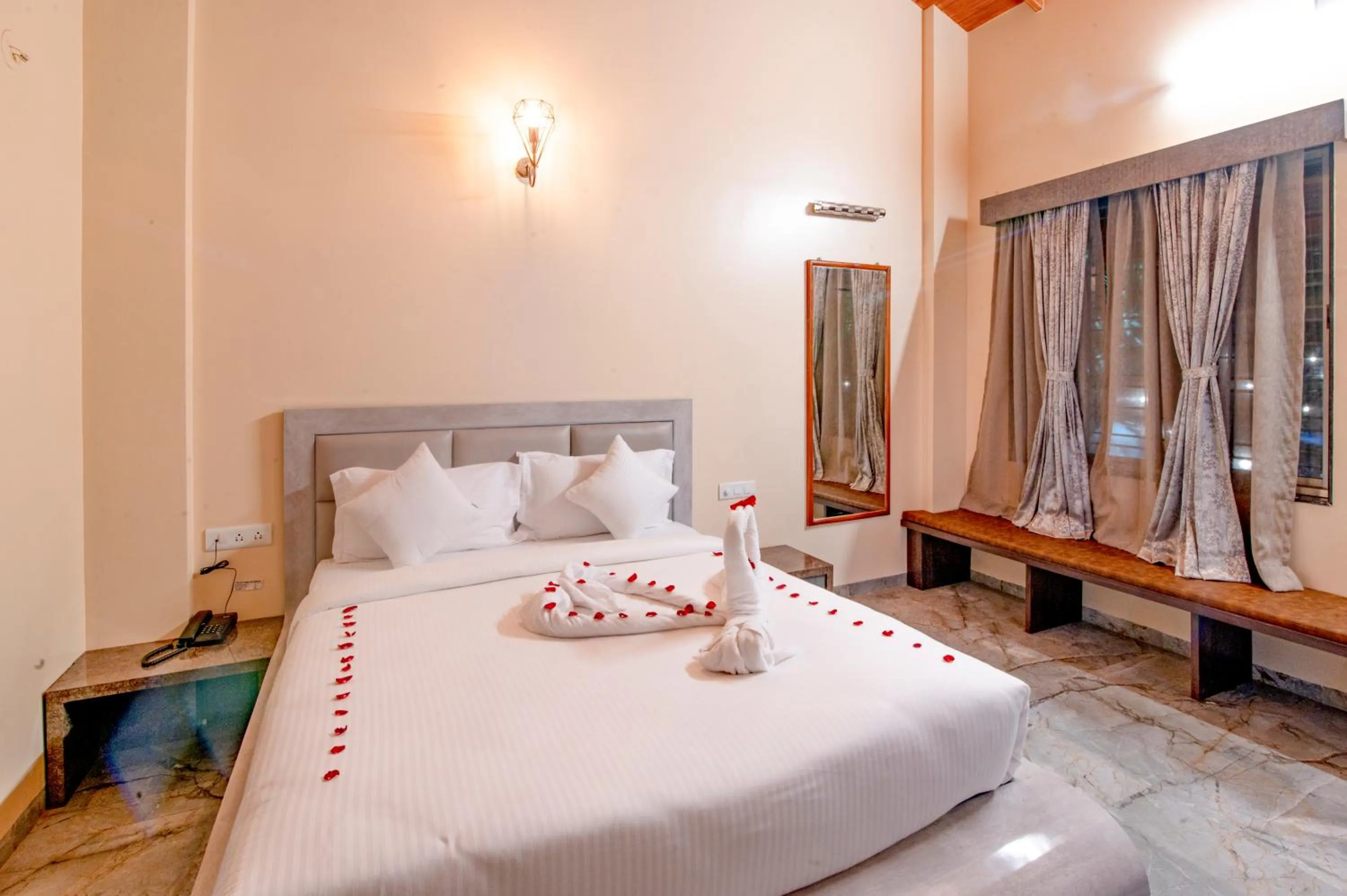 Bed in Freesia Resort by Express Inn