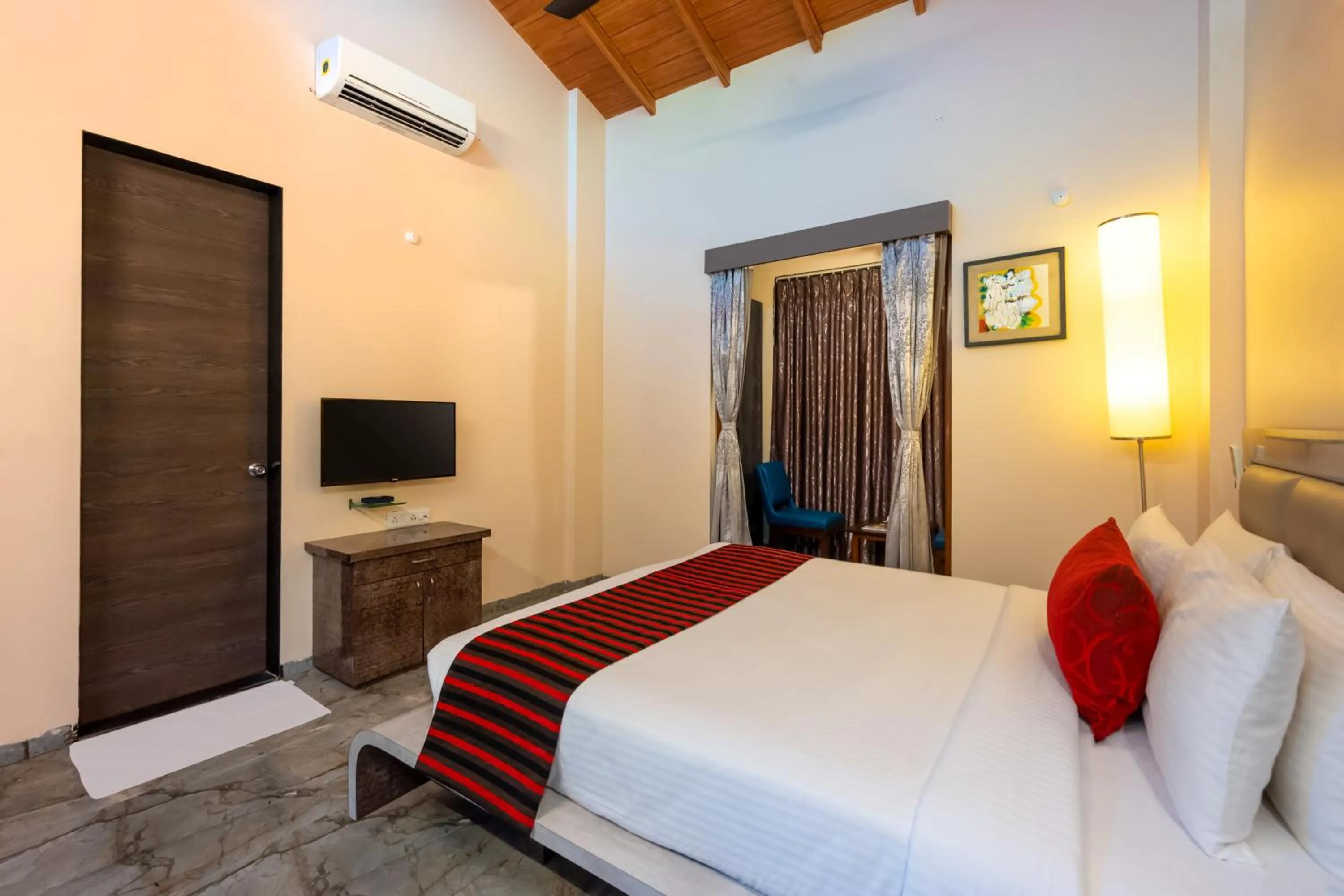 Bed in Freesia Resort by Express Inn