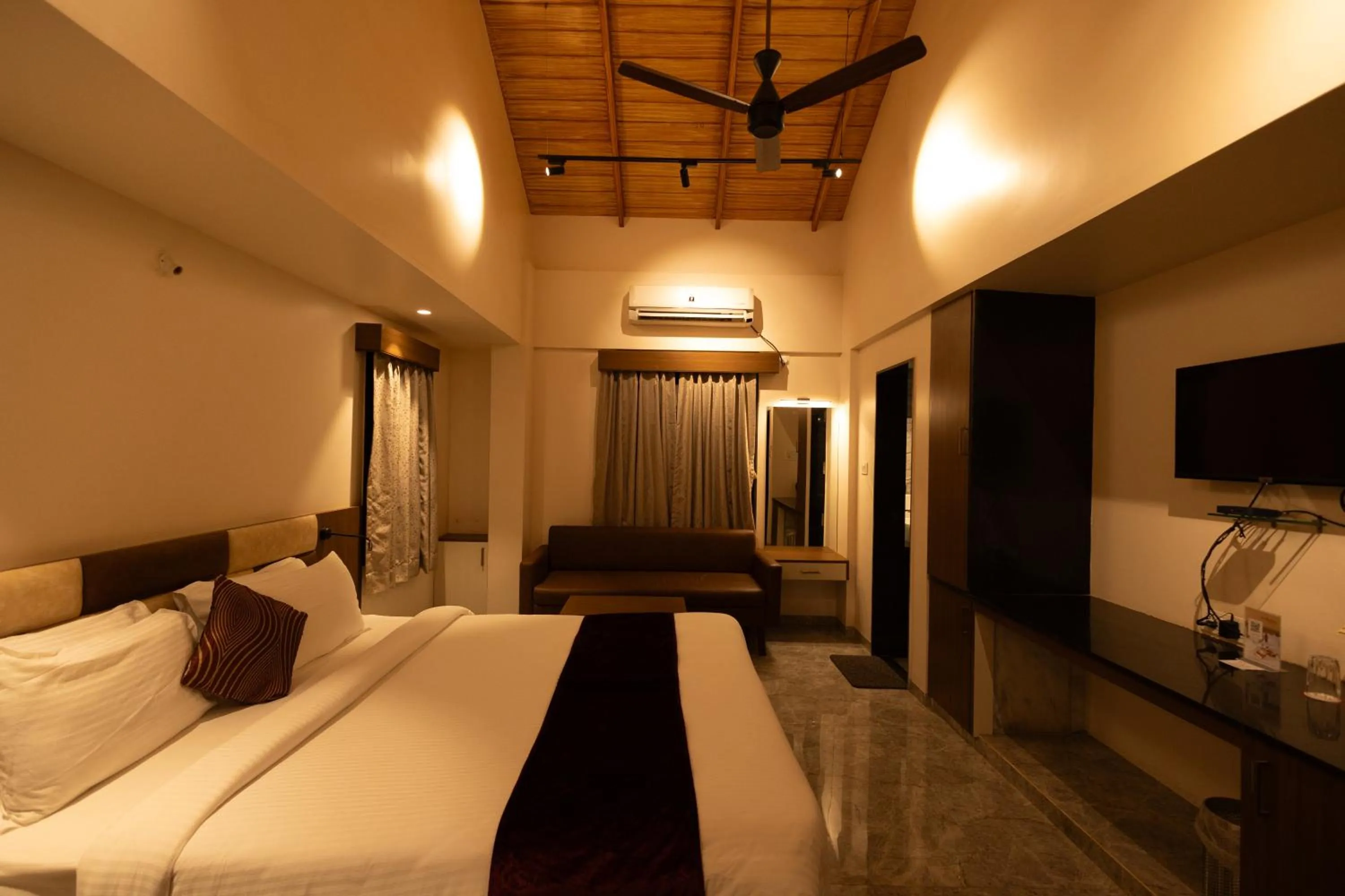 Bed in Freesia Resort by Express Inn