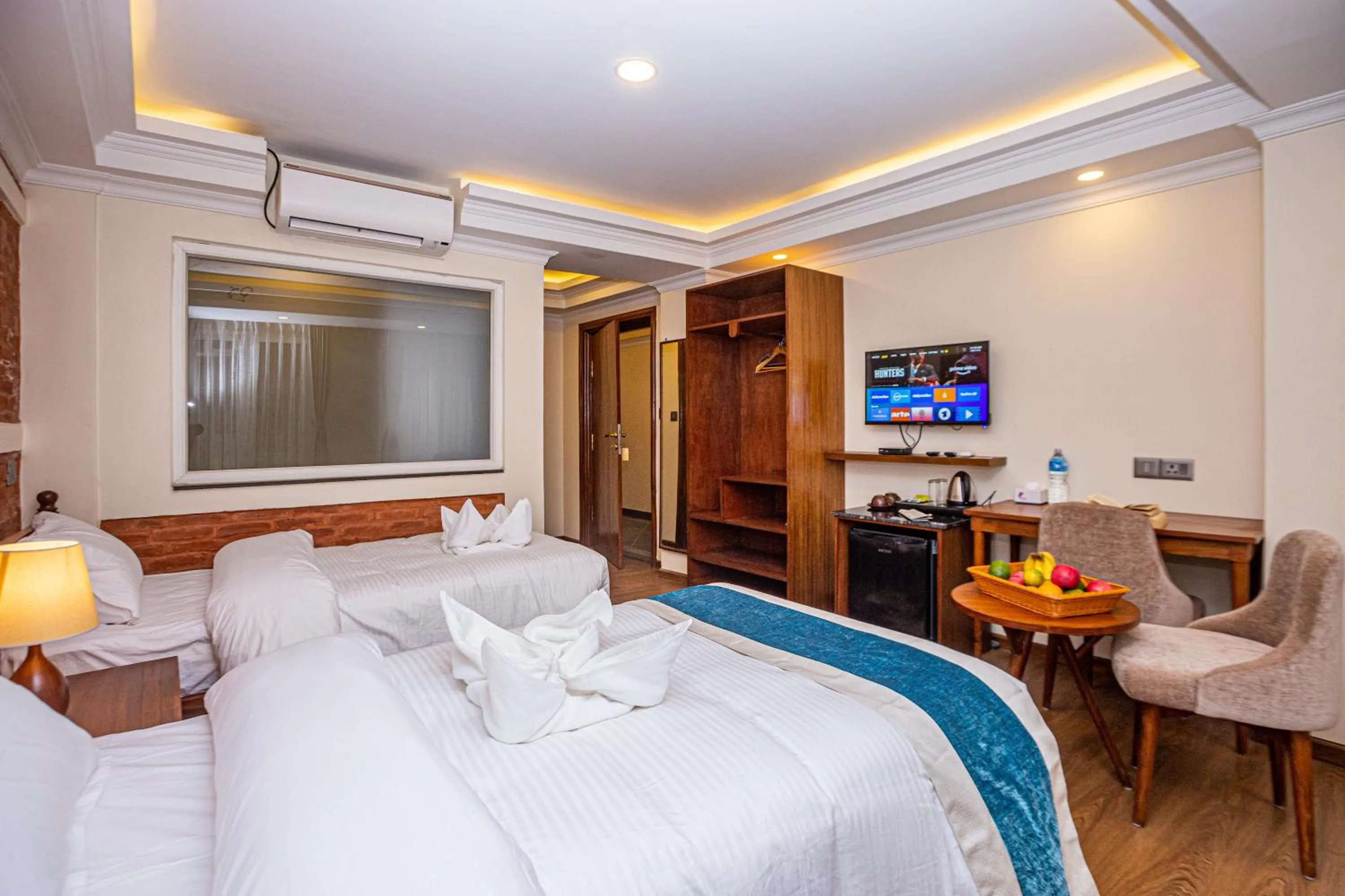 Communal lounge/ TV room, Bed in Darbar Heritage Inn