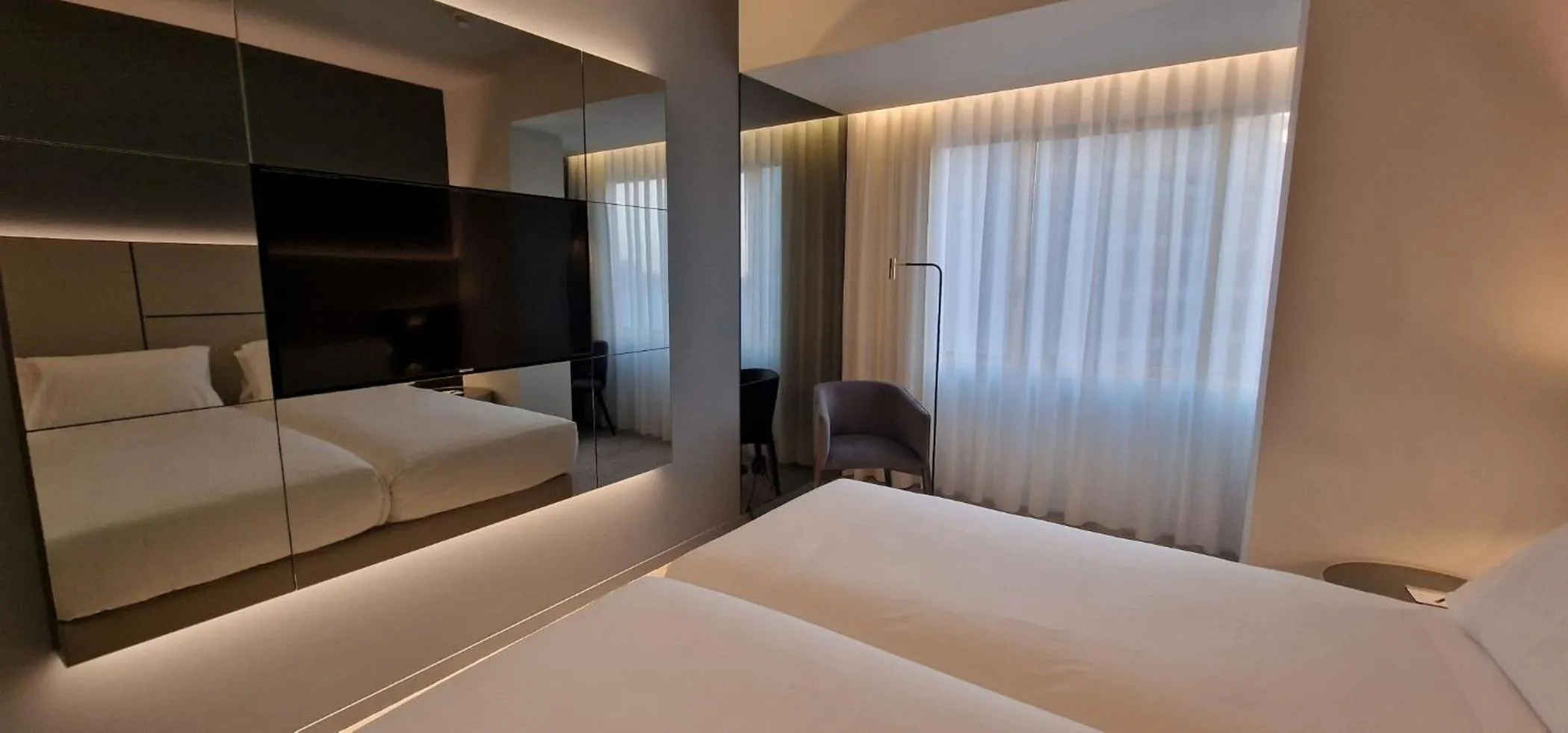 Bed in Bom Sucesso Hotel by gaiarooms