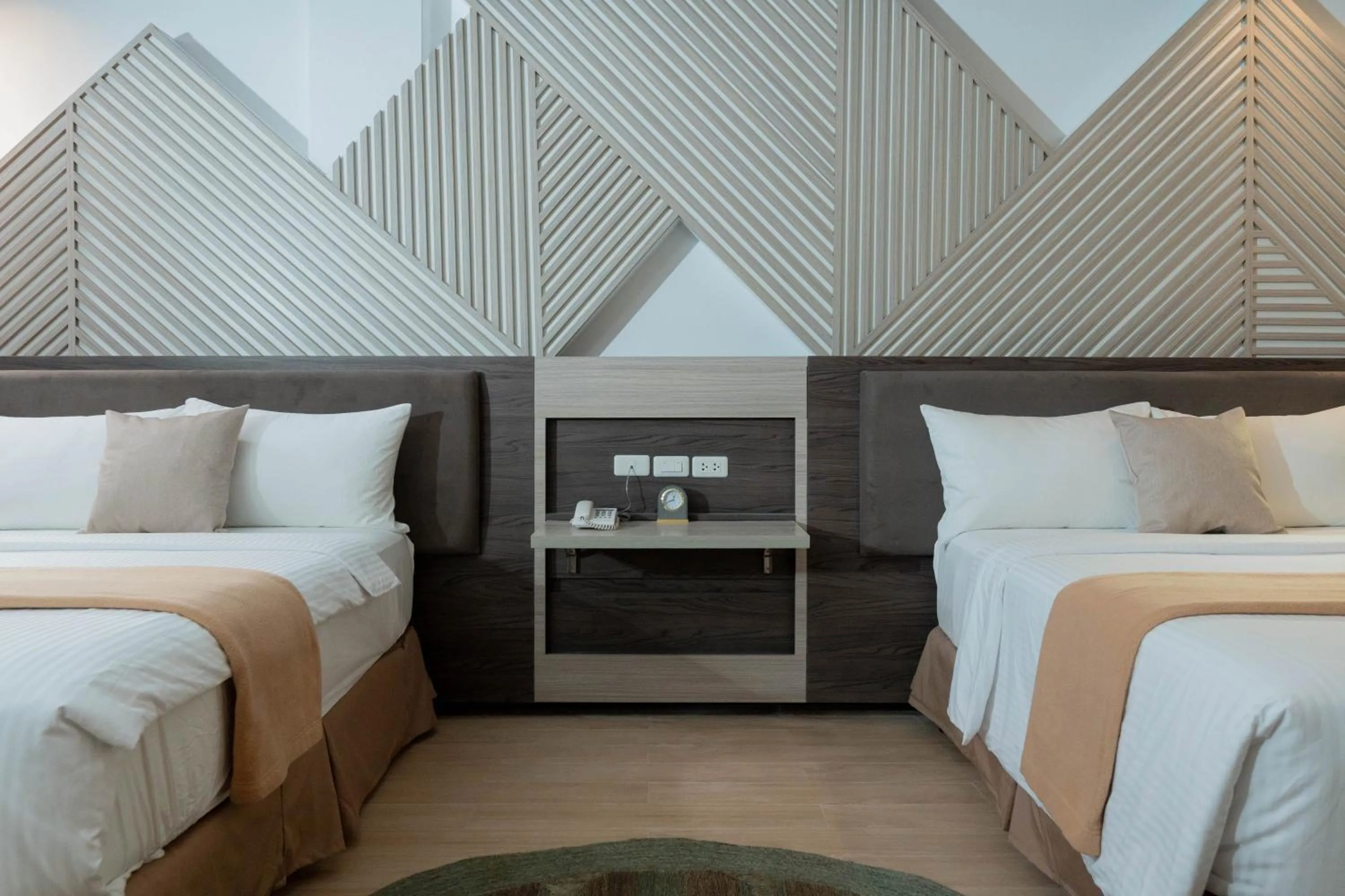 Bed in Adelina Hotel and Suites