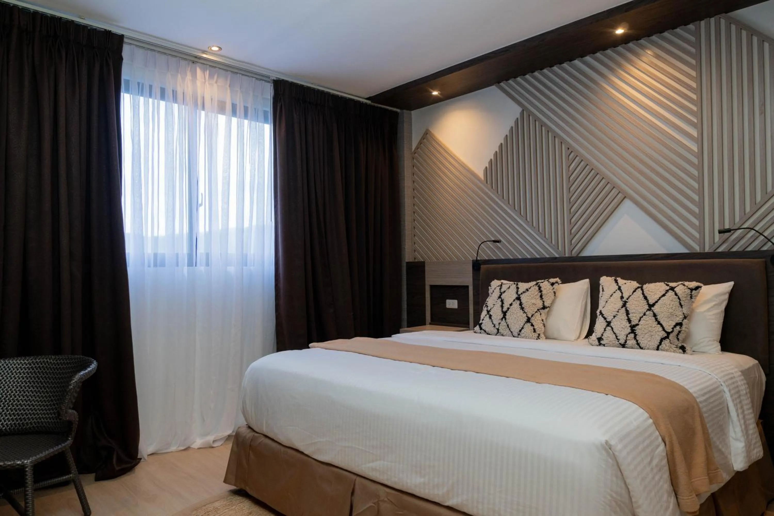 Bed in Adelina Hotel and Suites
