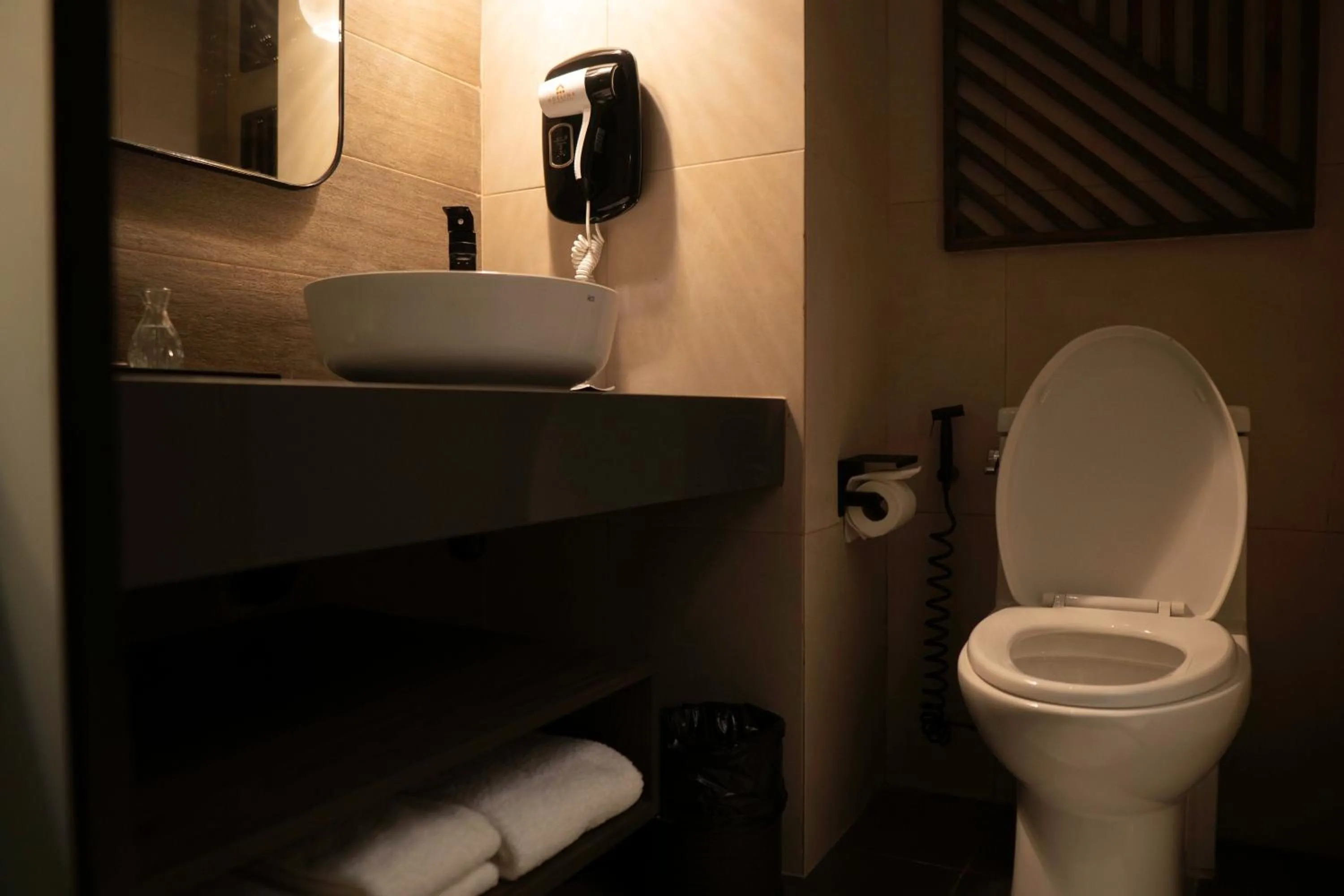 Toilet in Adelina Hotel and Suites