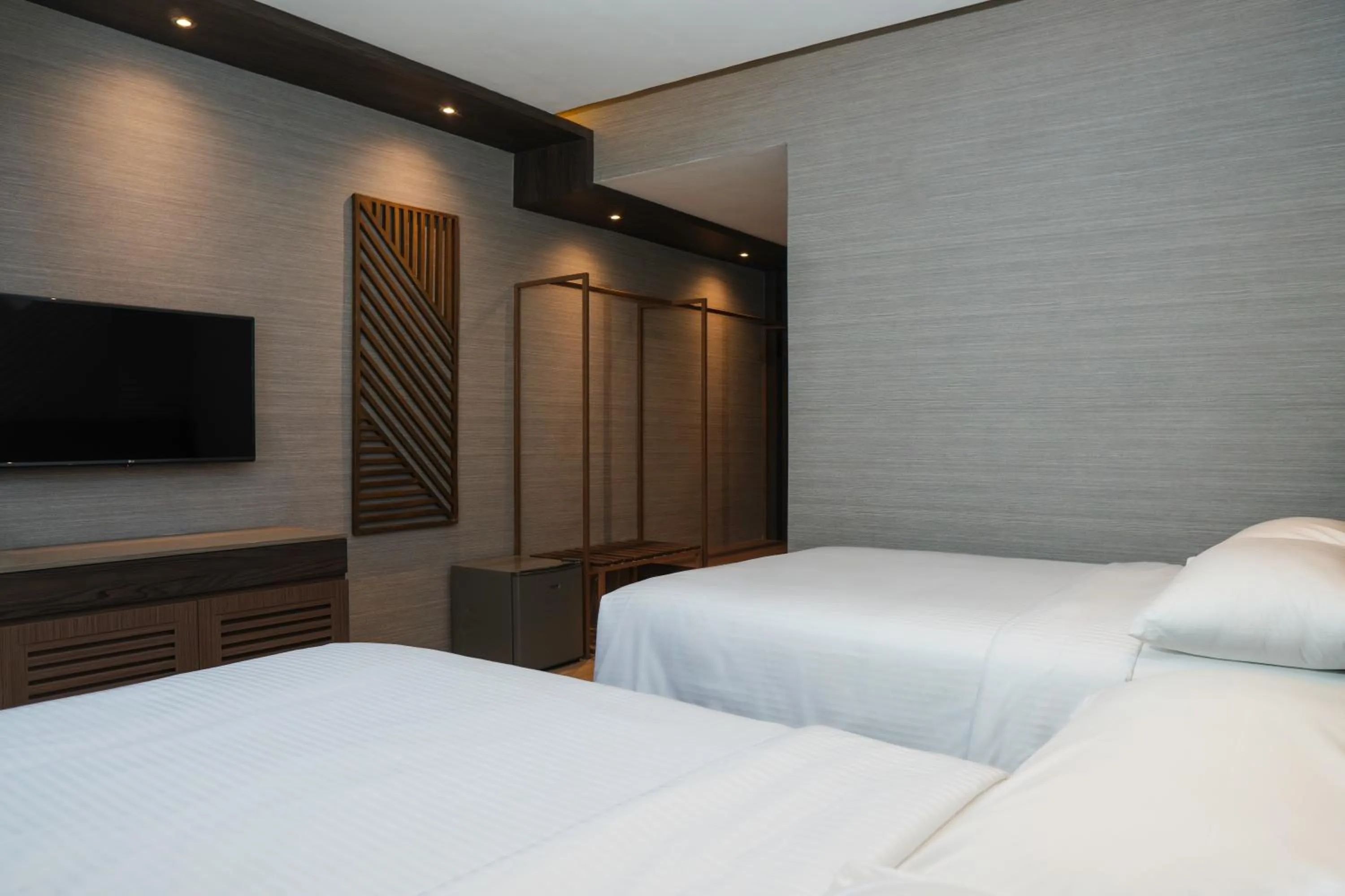 Bed in Adelina Hotel and Suites