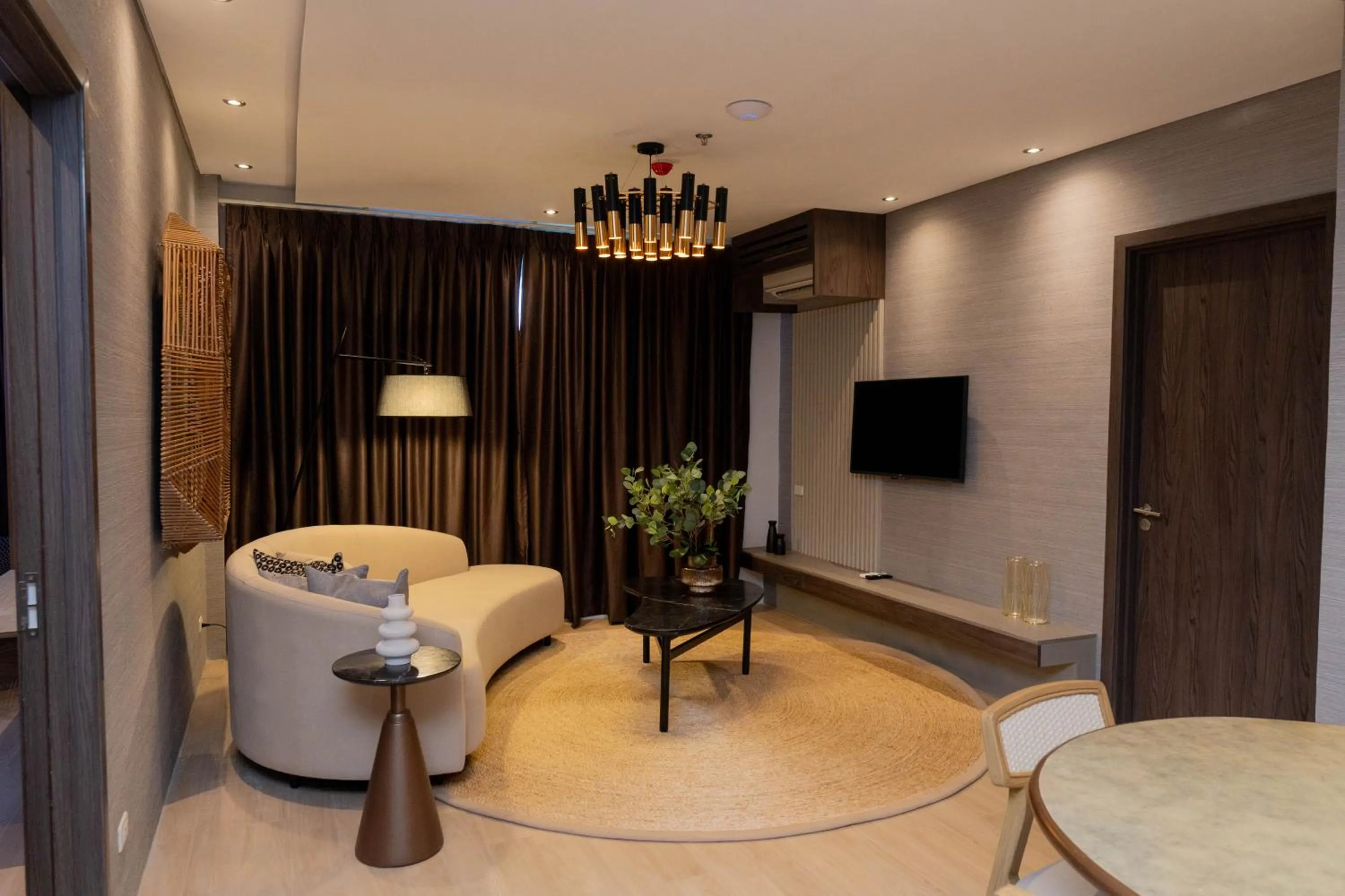 Communal lounge/ TV room in Adelina Hotel and Suites