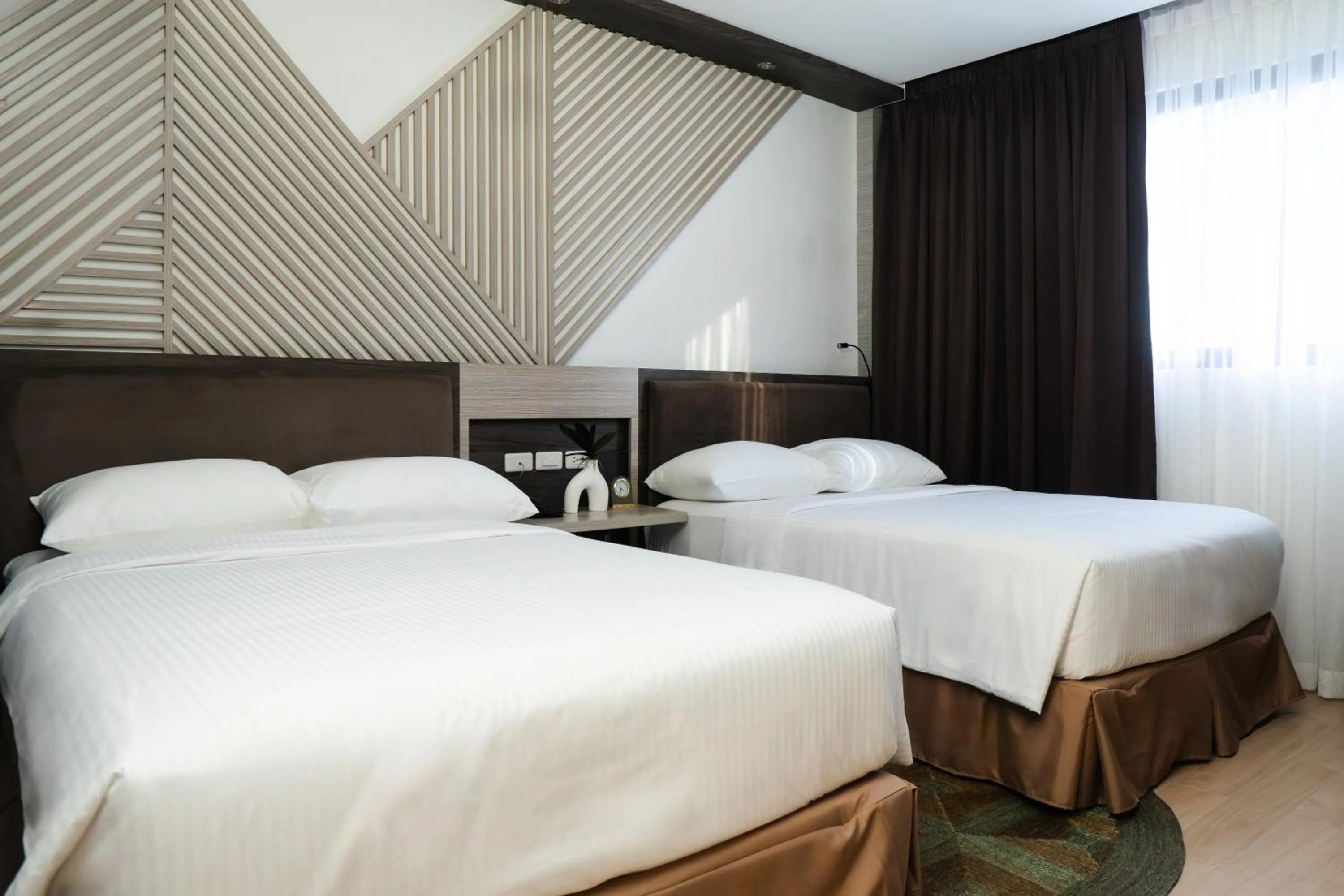 Bed in Adelina Hotel and Suites