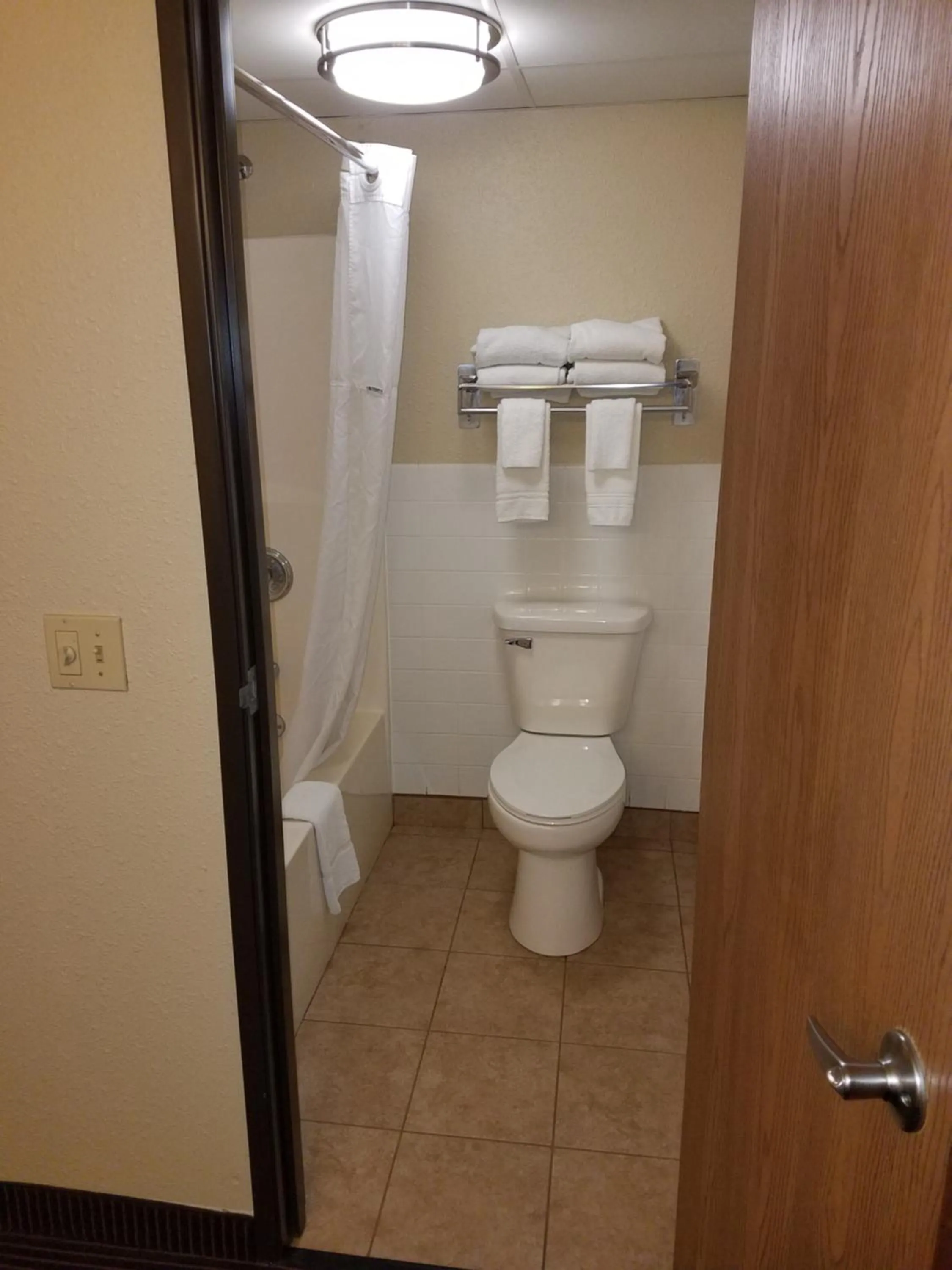 Bathroom in AmericInn by Wyndham Menomonie