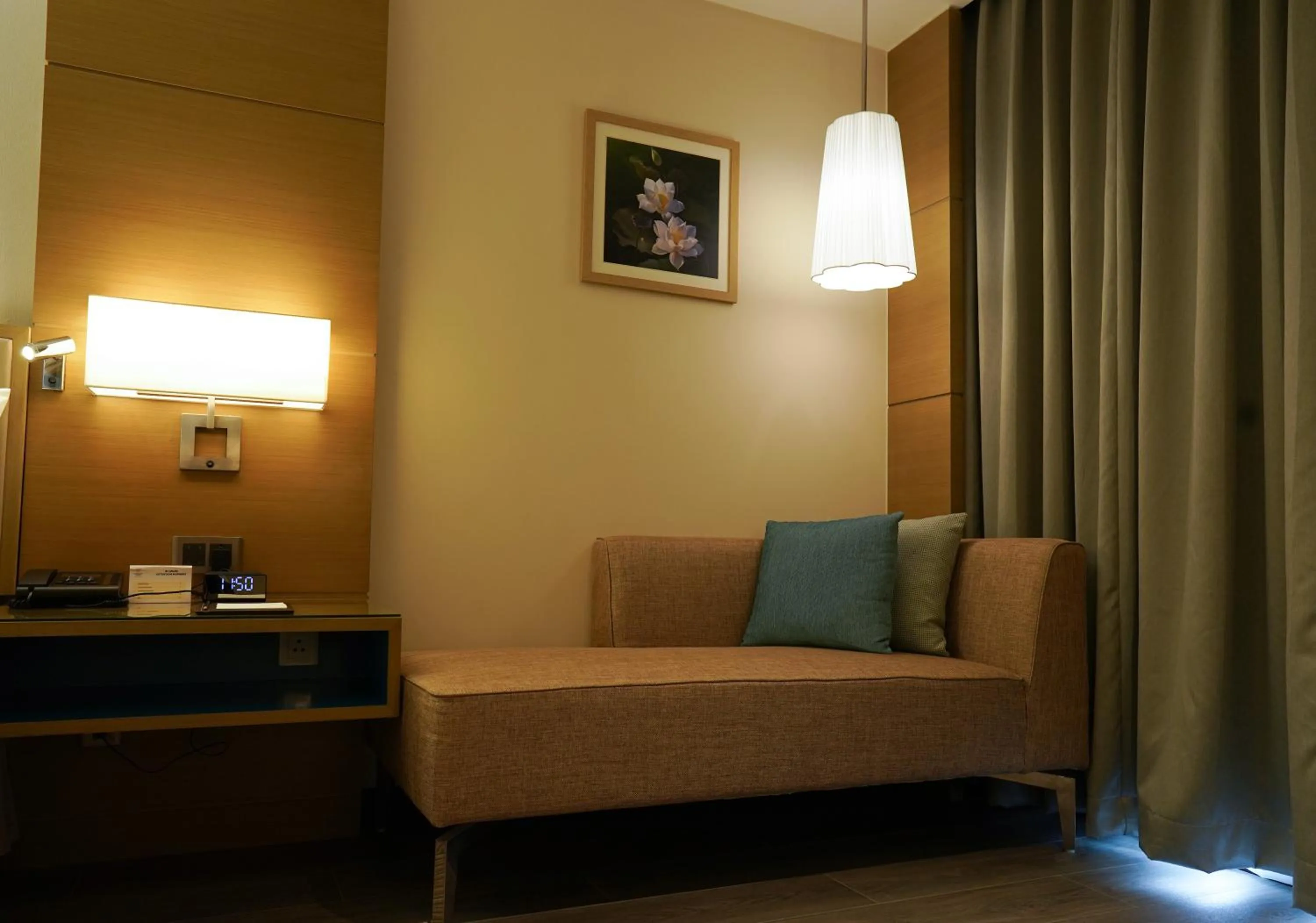 Seating area, Bed in Gokulam Grand Trivandrum