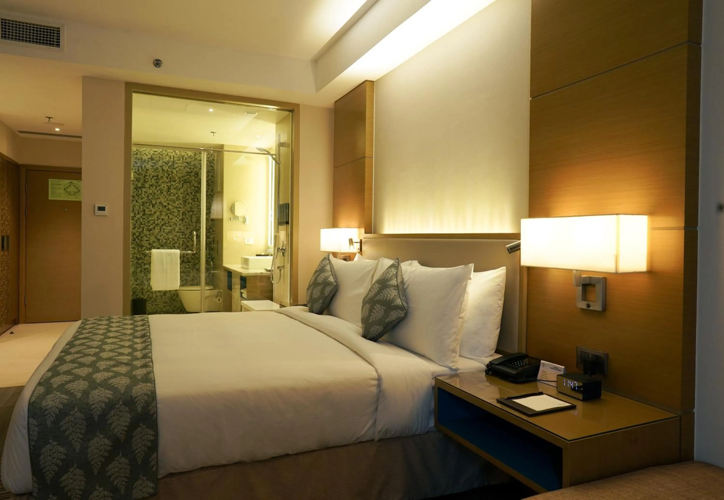 Bedroom, Bed in Gokulam Grand Trivandrum