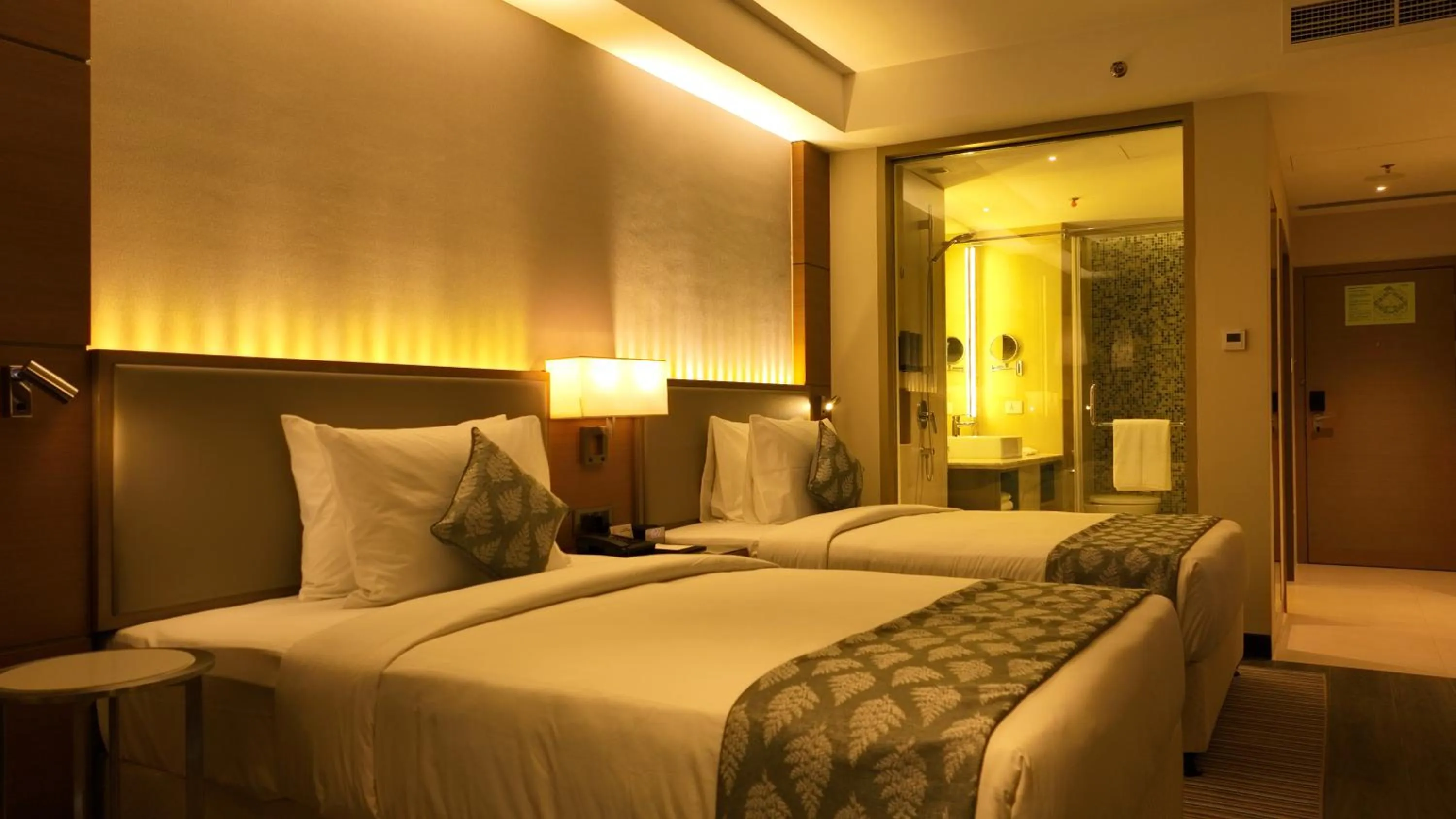 Bedroom, Bed in Gokulam Grand Trivandrum