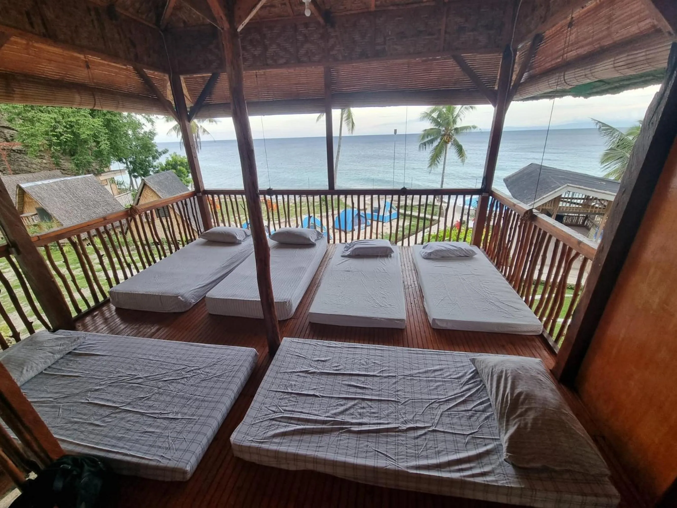 Bed in Hagdan Reef Dive Spot by HiveRooms