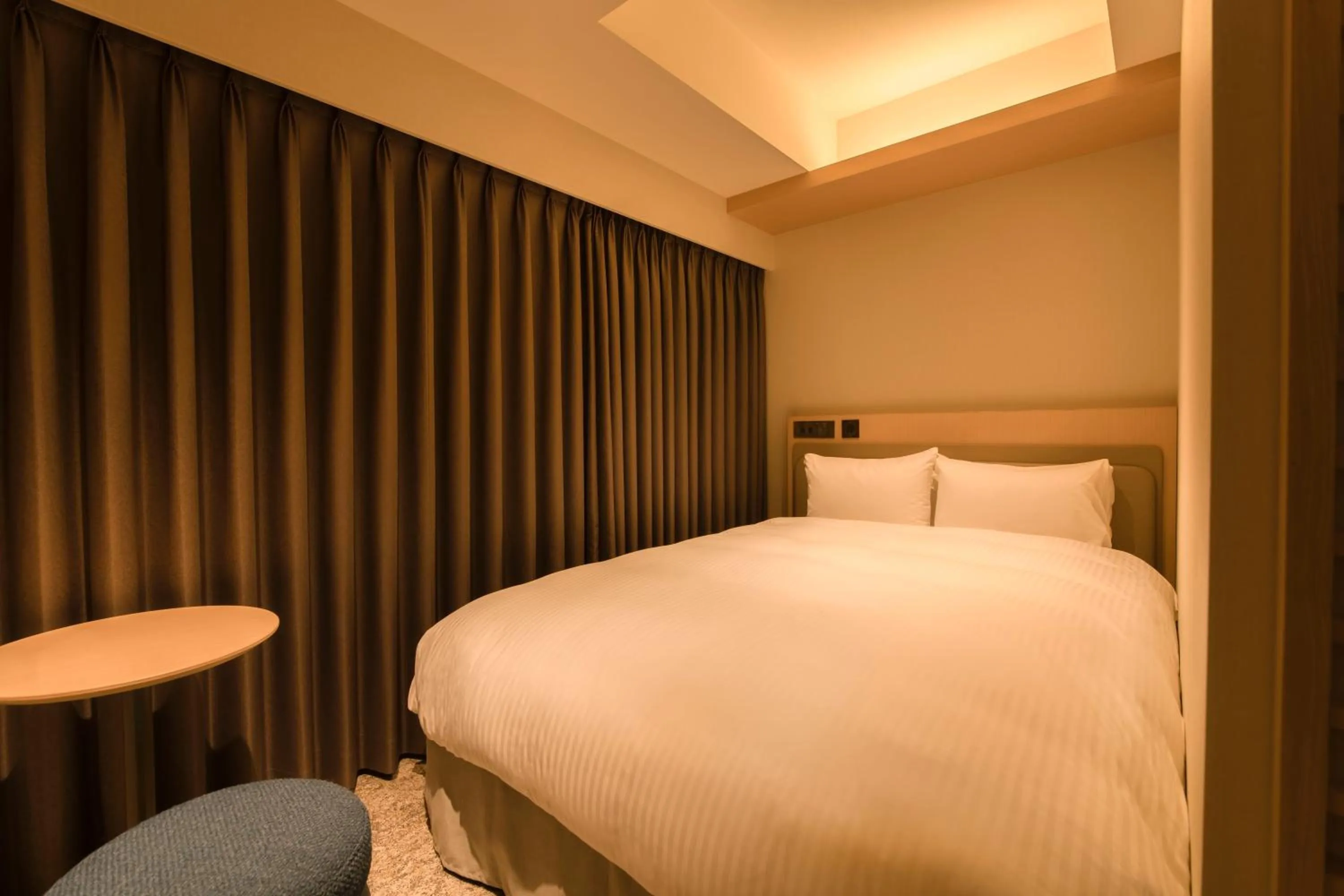 Bed in Hotel Emion Sapporo