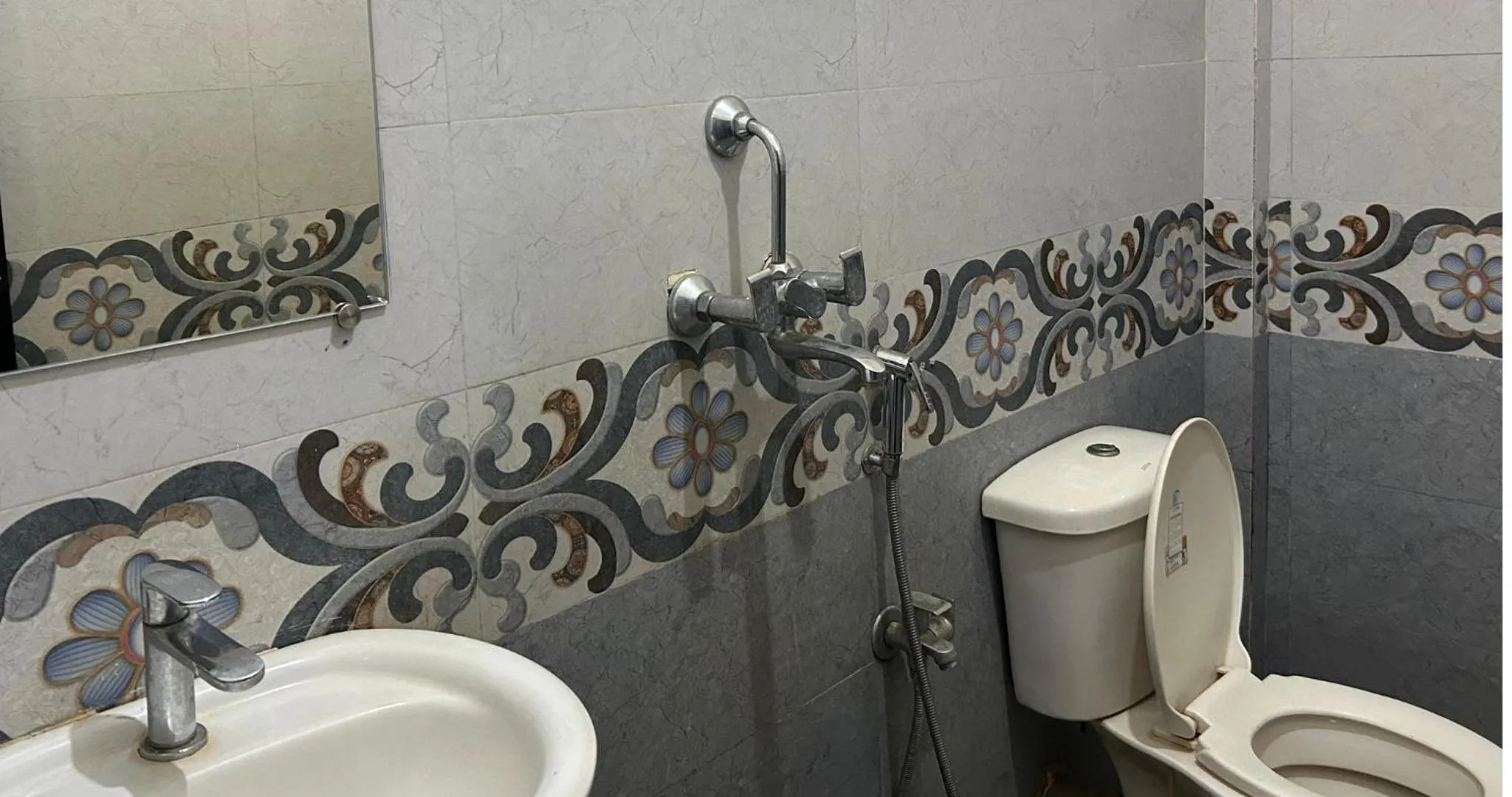 Toilet in Aqua Wave by YogiTree Hotels