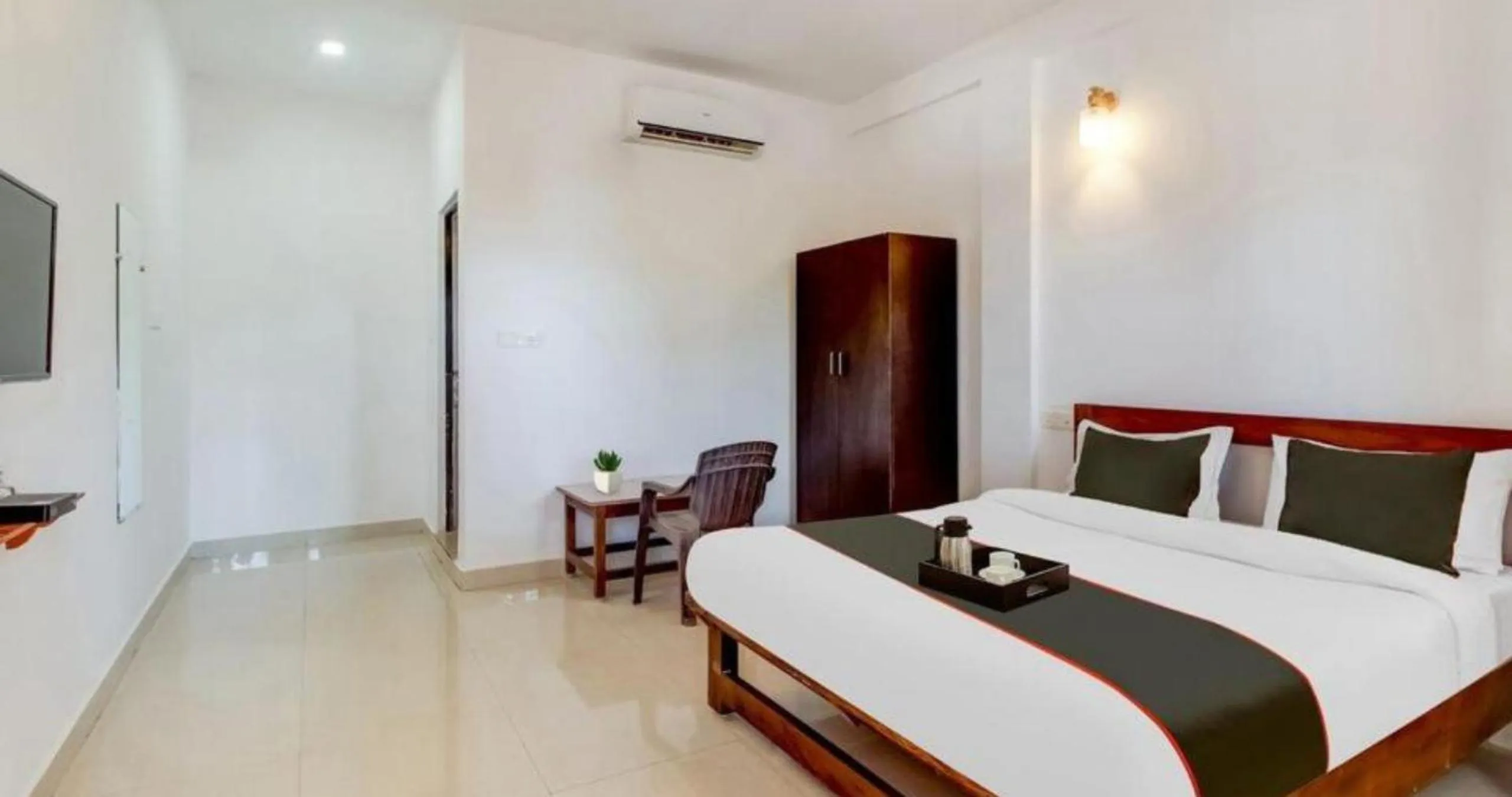 Bed in Aqua Wave by YogiTree Hotels