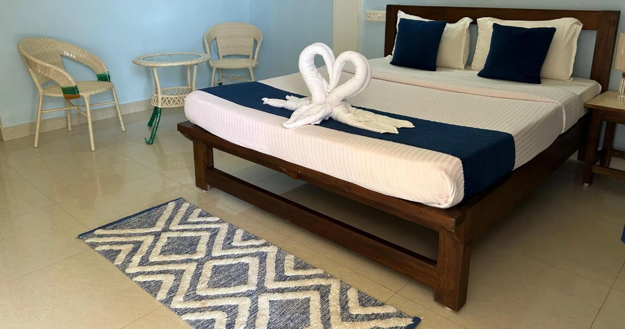 Bed in Aqua Wave by YogiTree Hotels