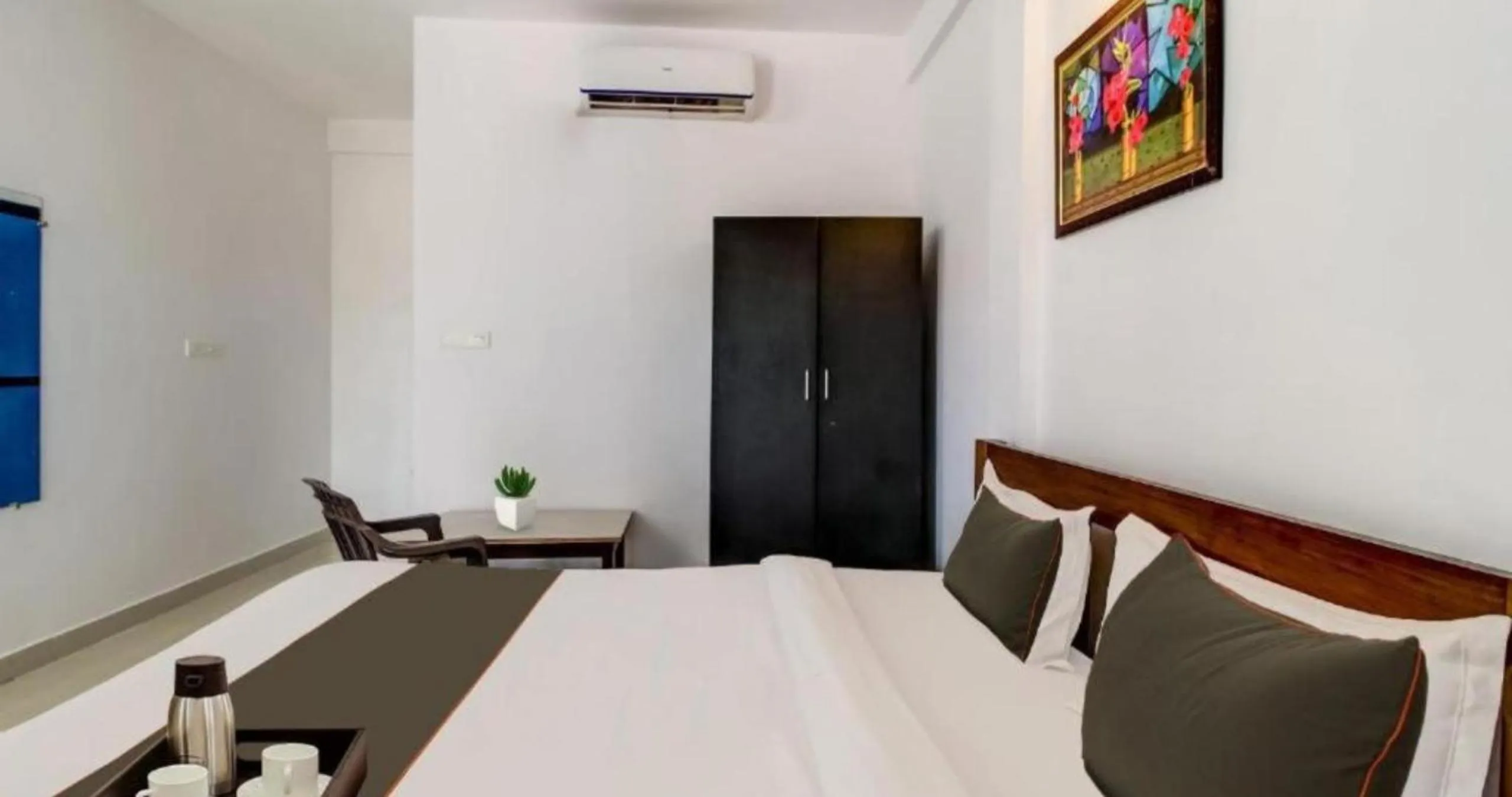 Bed in Aqua Wave by YogiTree Hotels