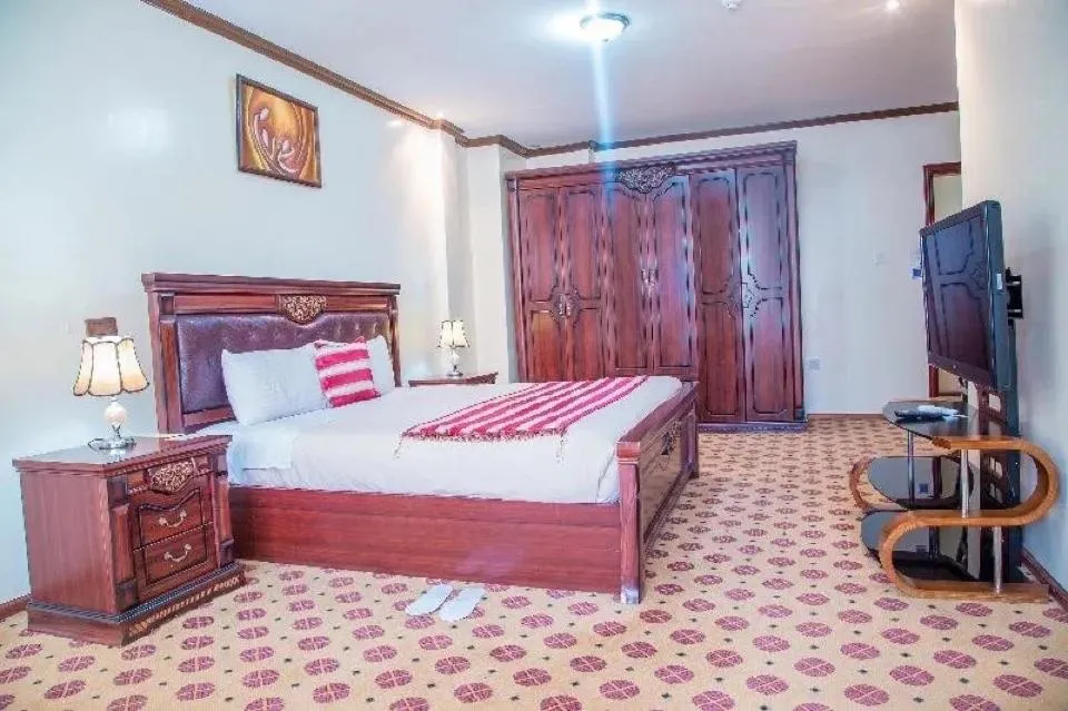 Bed in Hotel Karisimbi