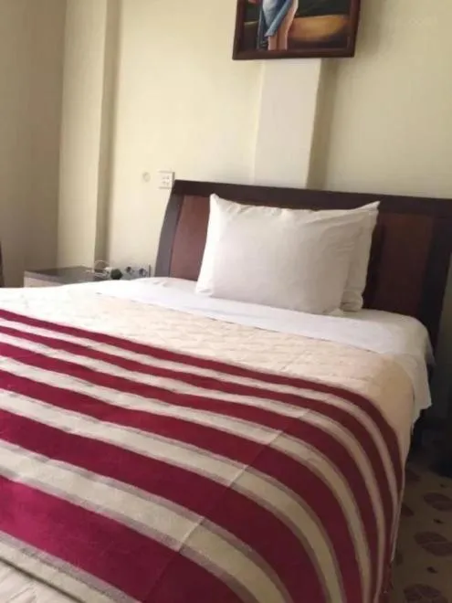 Bed in Hotel Karisimbi