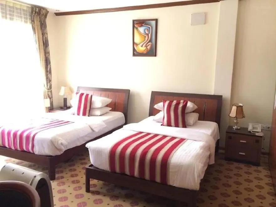 Bed in Hotel Karisimbi