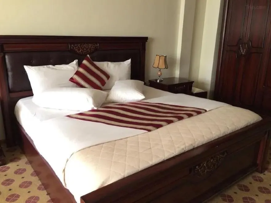 Bed in Hotel Karisimbi