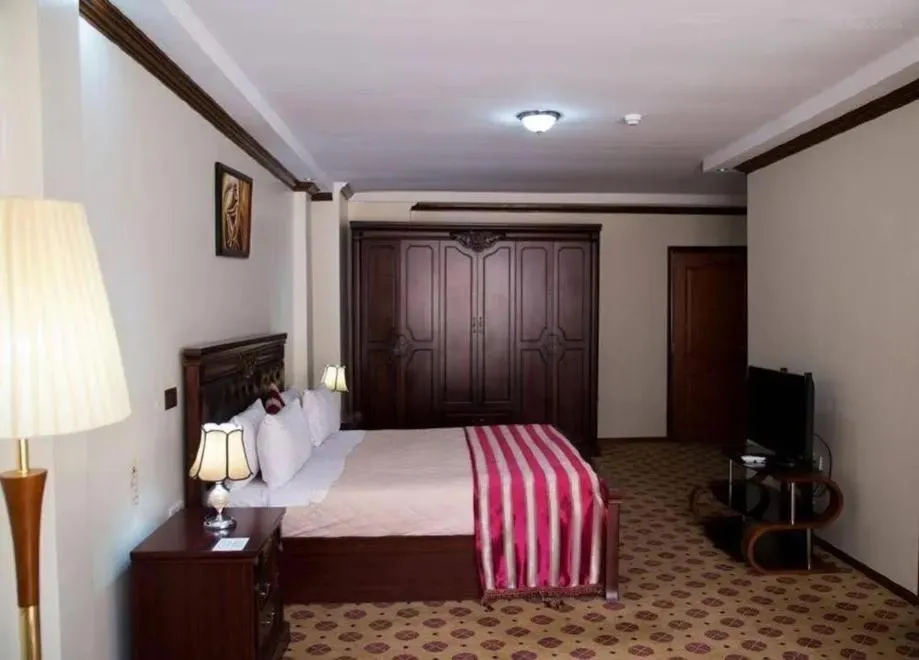 Bed in Hotel Karisimbi