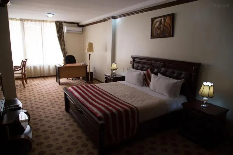 Bed in Hotel Karisimbi