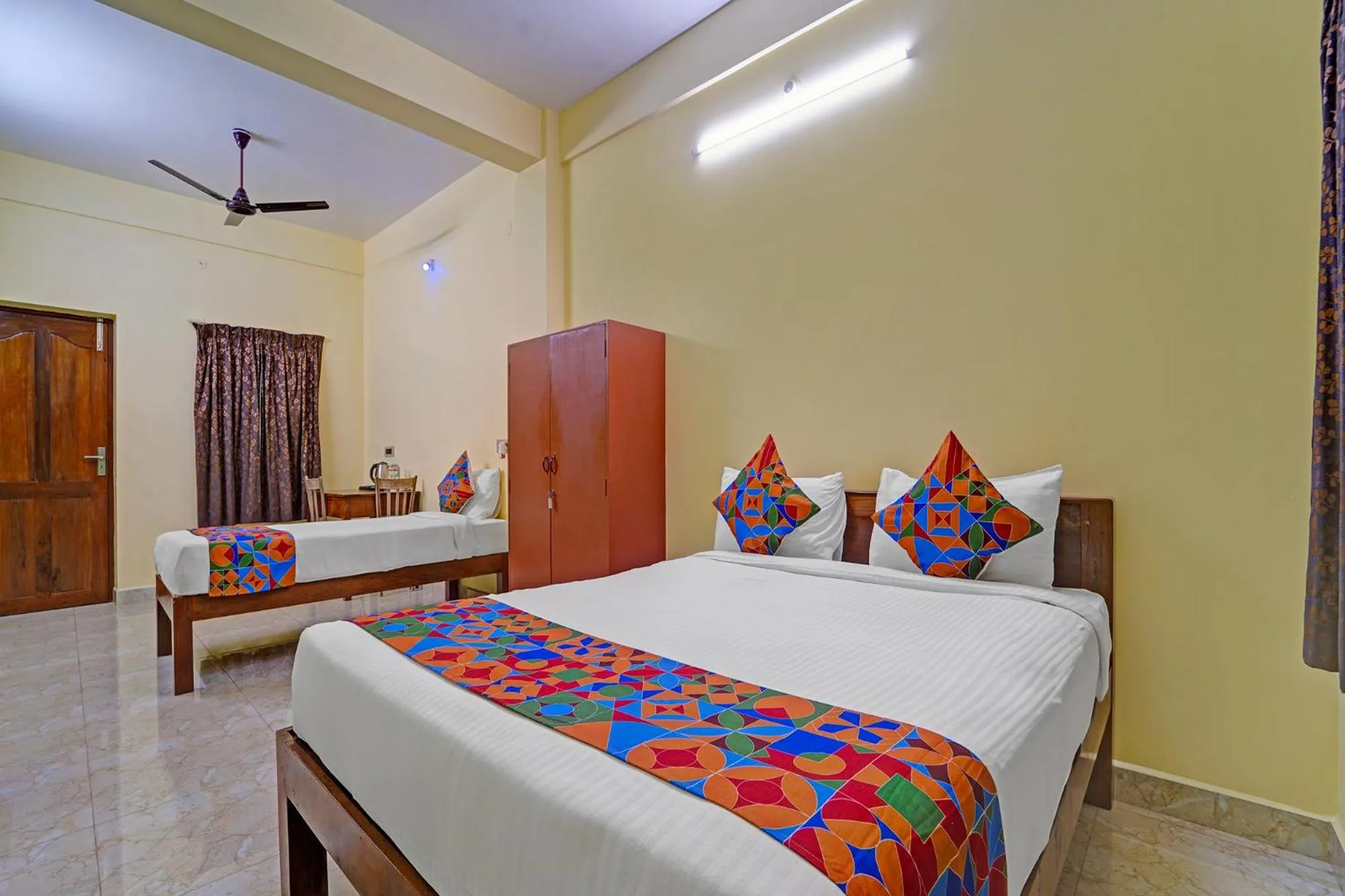 Bed in FabHotel Martine's Residency - French Colony, 5 Mins from Rock Beach