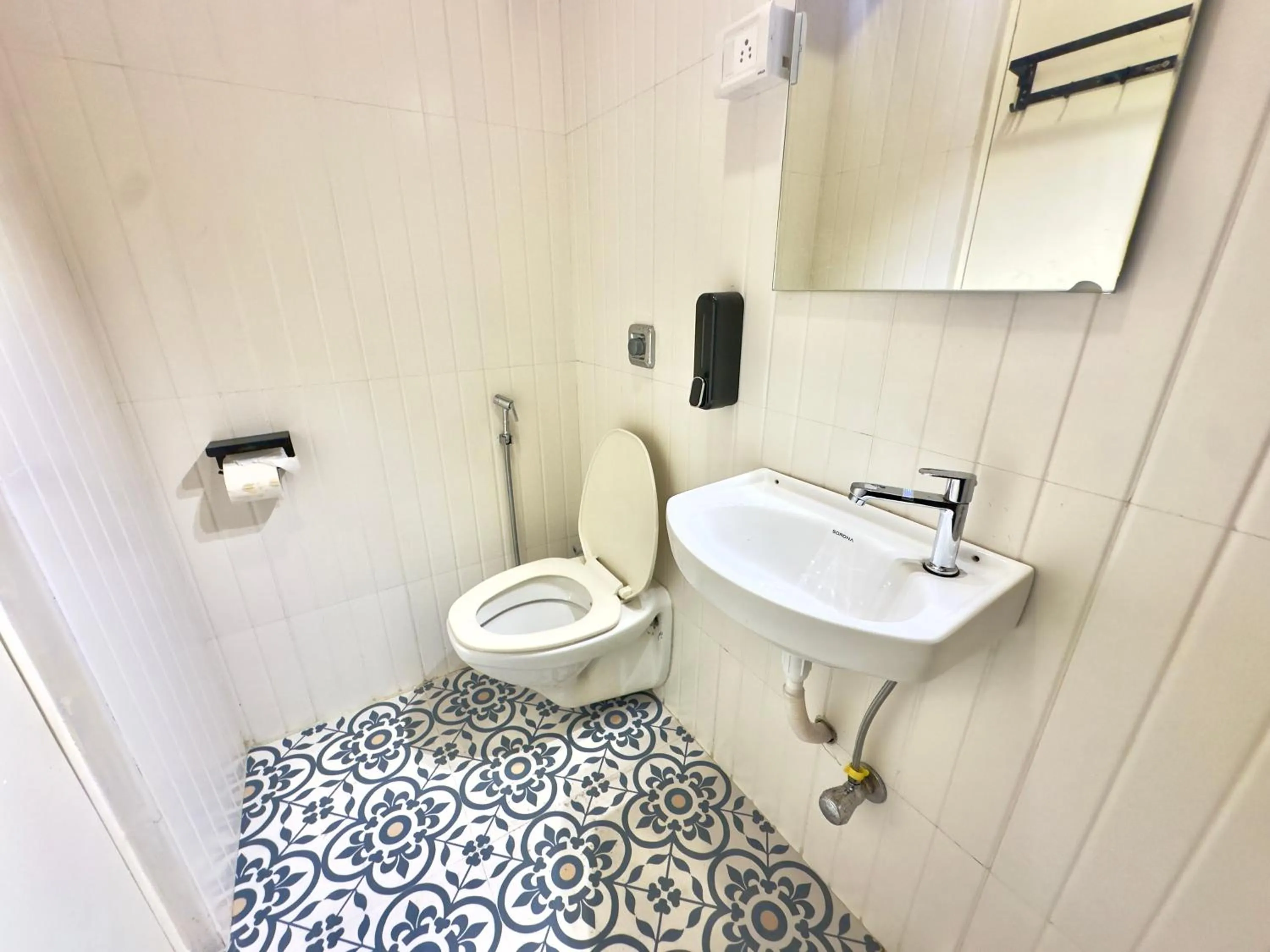 Toilet in Locomo Hostel Express - Stay Work Eat