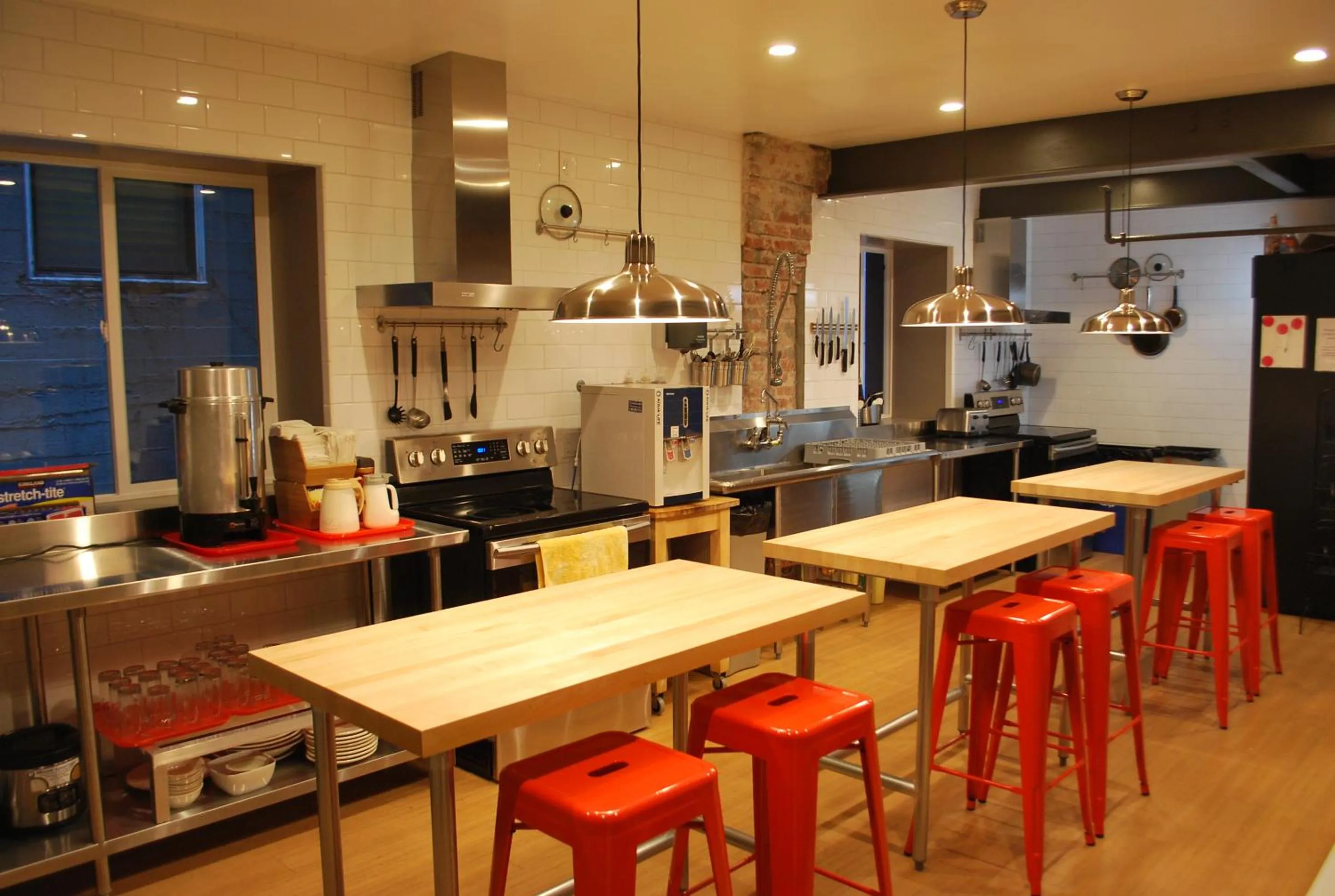 Communal kitchen in Orange Village Hostel