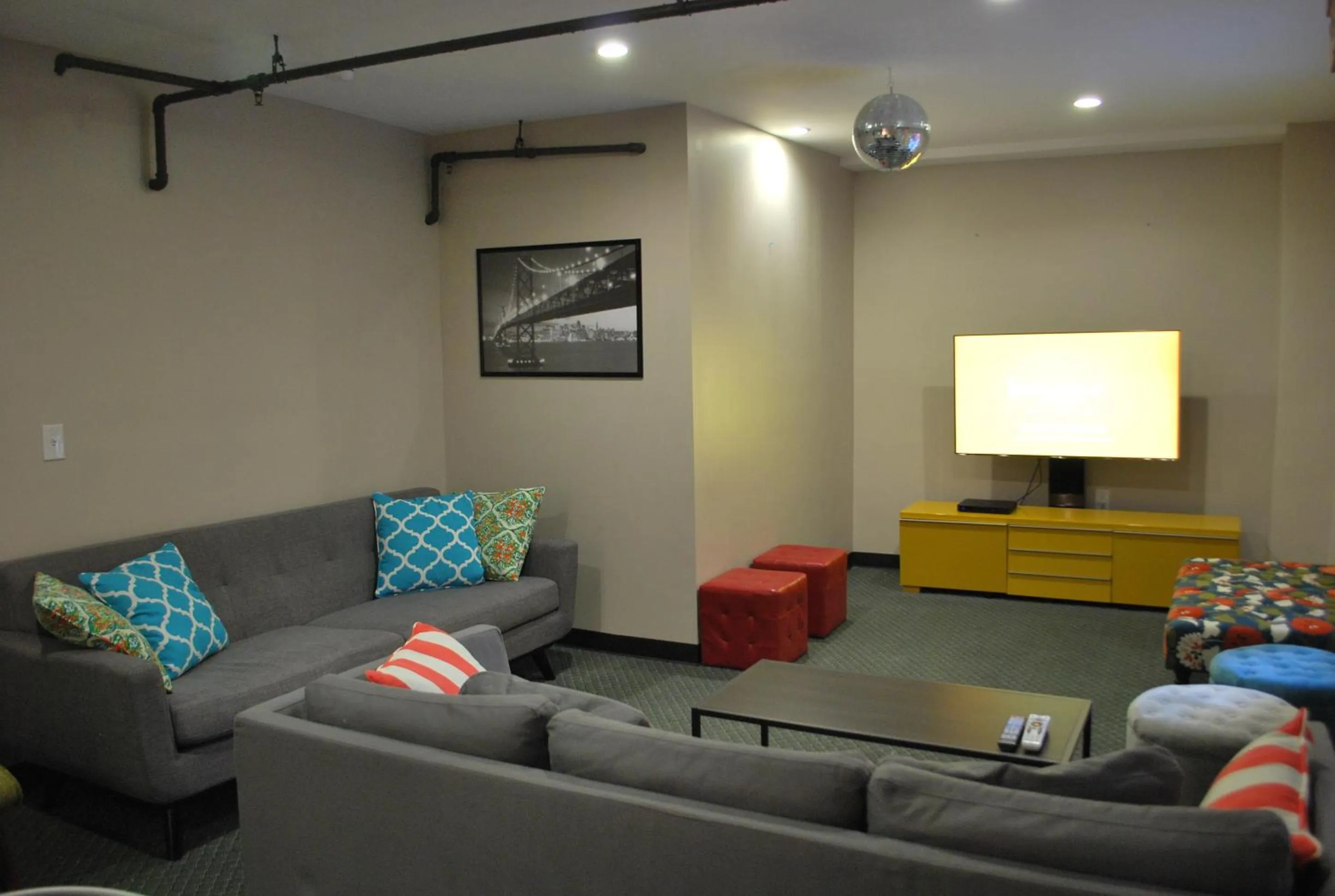 Communal lounge/ TV room in Orange Village Hostel