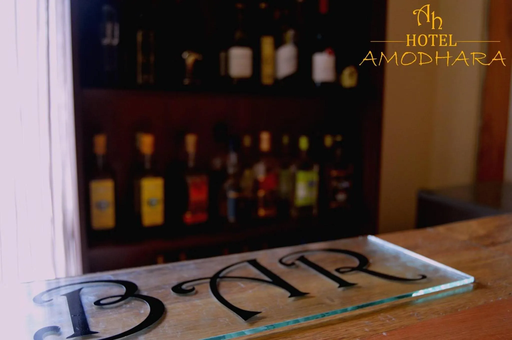 Property logo or sign in Hotel Amodhara