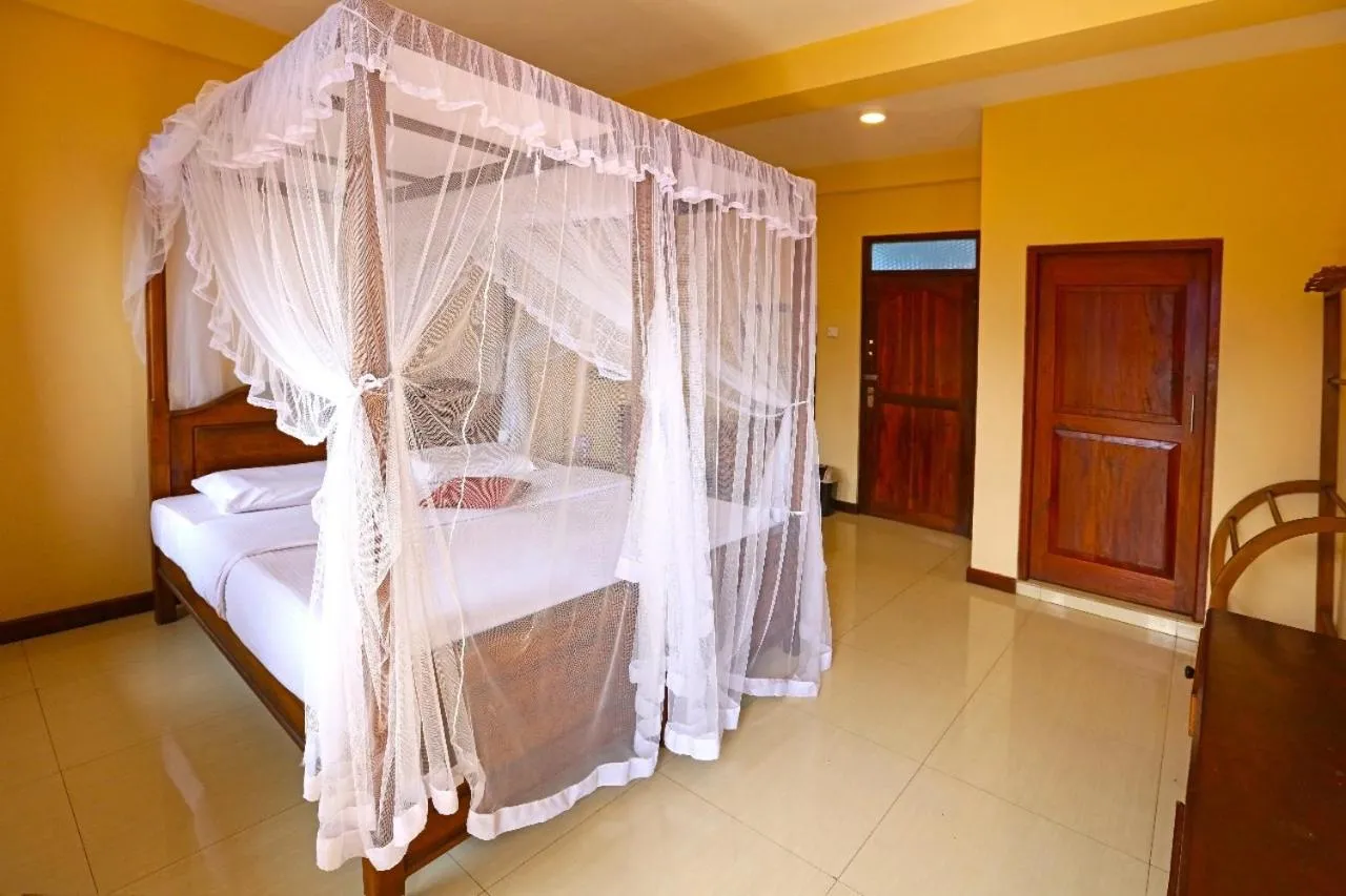 Bed in Srilak View Holiday Inn