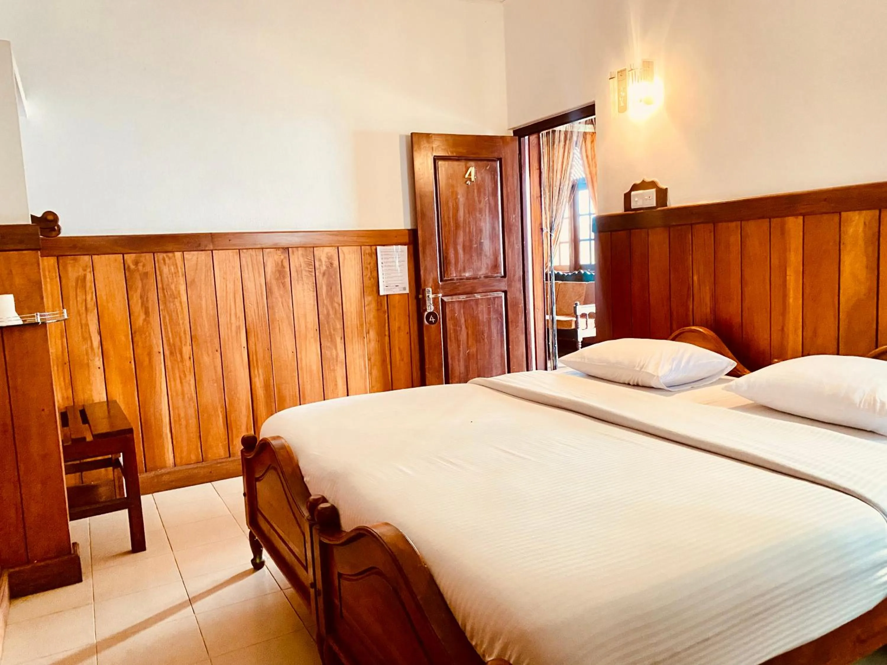 Bed in Srilak View Holiday Inn