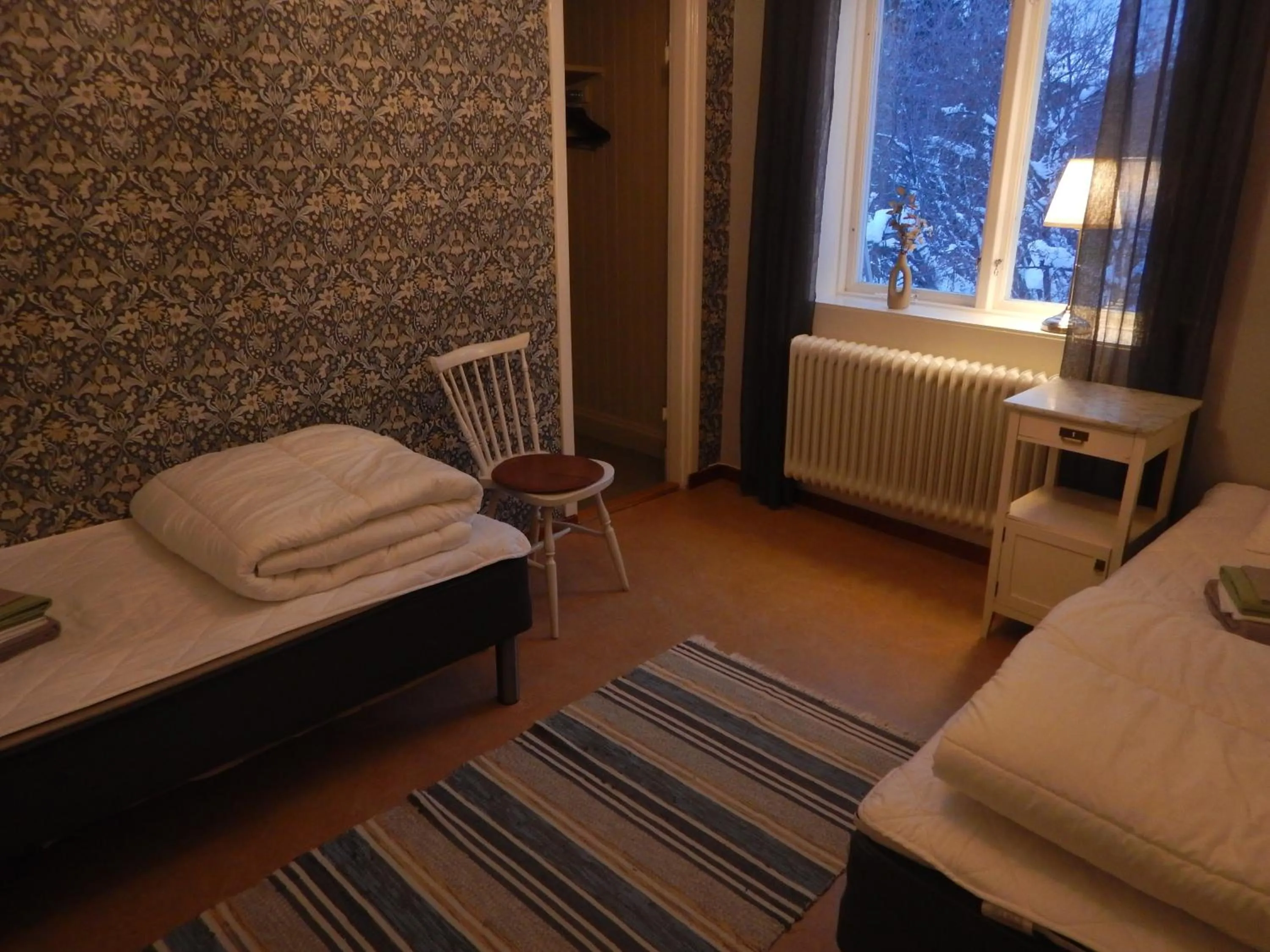 Photo of the whole room, Bed in Jokkmokks Vandrarhem Åsgård