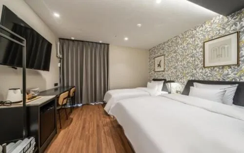 Bed in Brown Dot Hotel Sajik Baseball Stadium