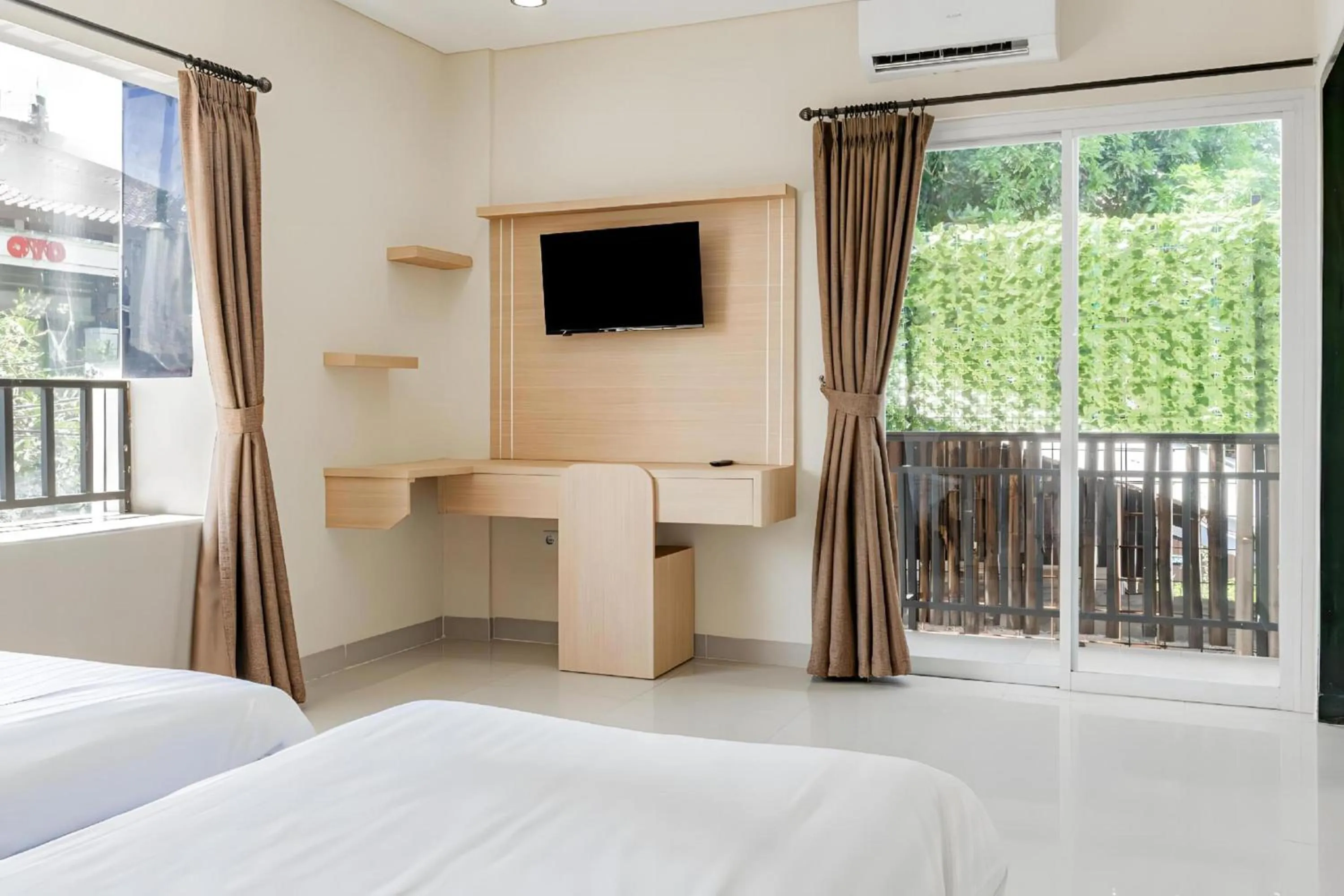 air conditioner, Bed in Collection O Kuta Near Airport Ngurah Rai