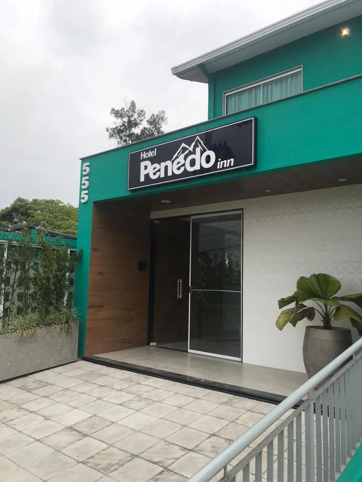 Property logo or sign in Hotel Penedo Inn