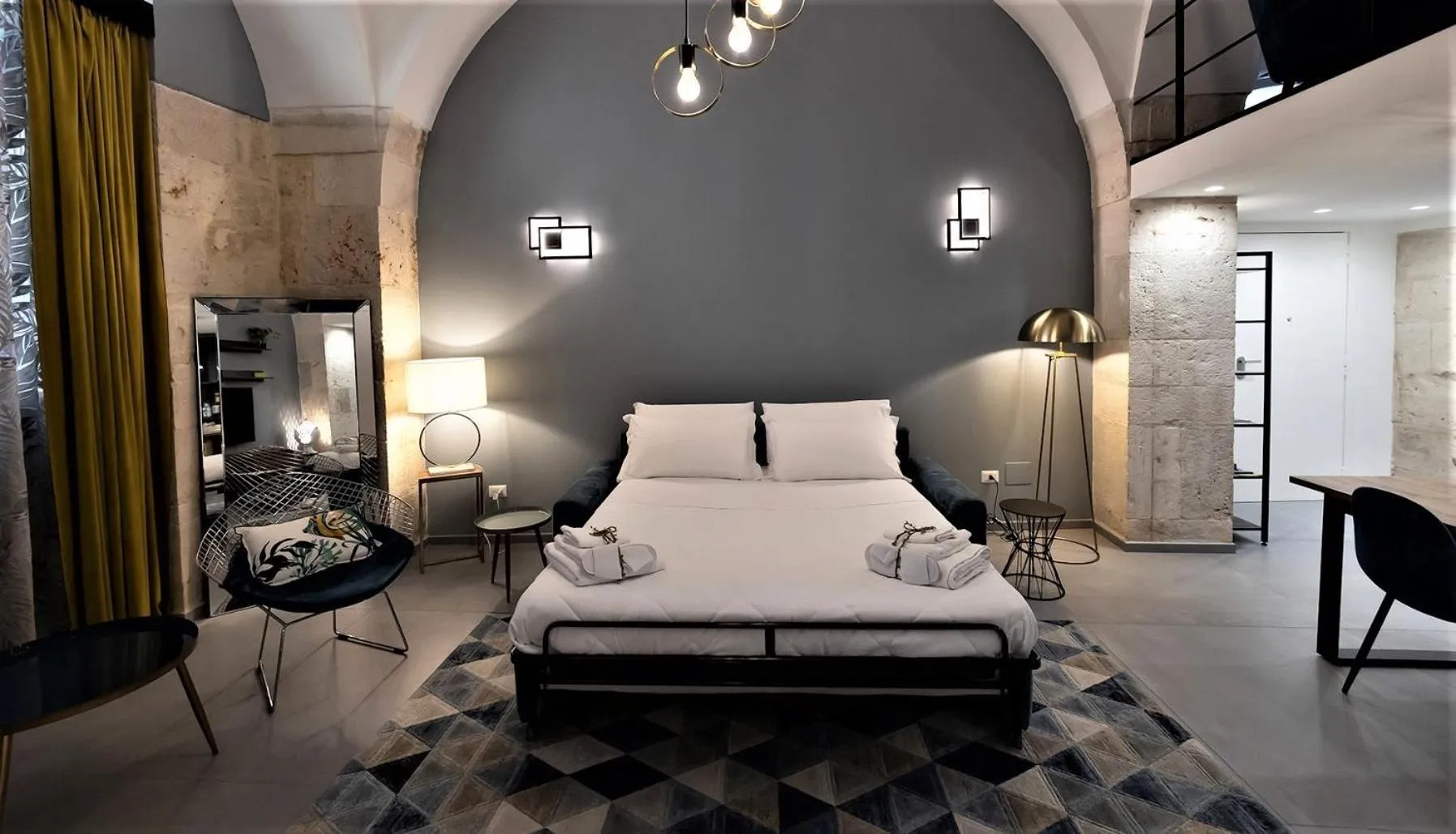 Bed in San Giacomo Loft Apartment