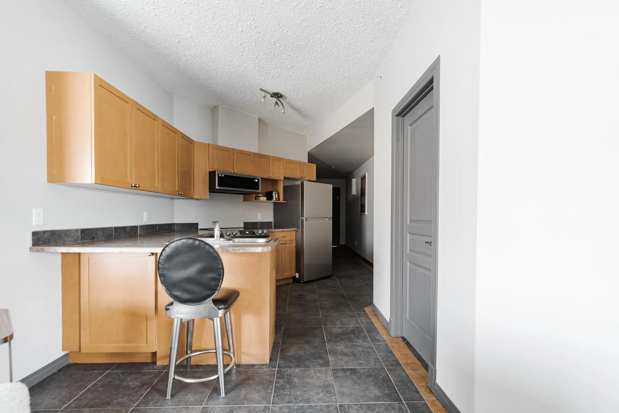 Kitchen or kitchenette in Premier Residence - Fort McMurray