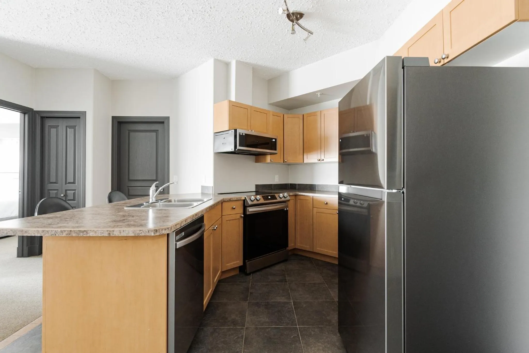Kitchen or kitchenette in Premier Residence - Fort McMurray
