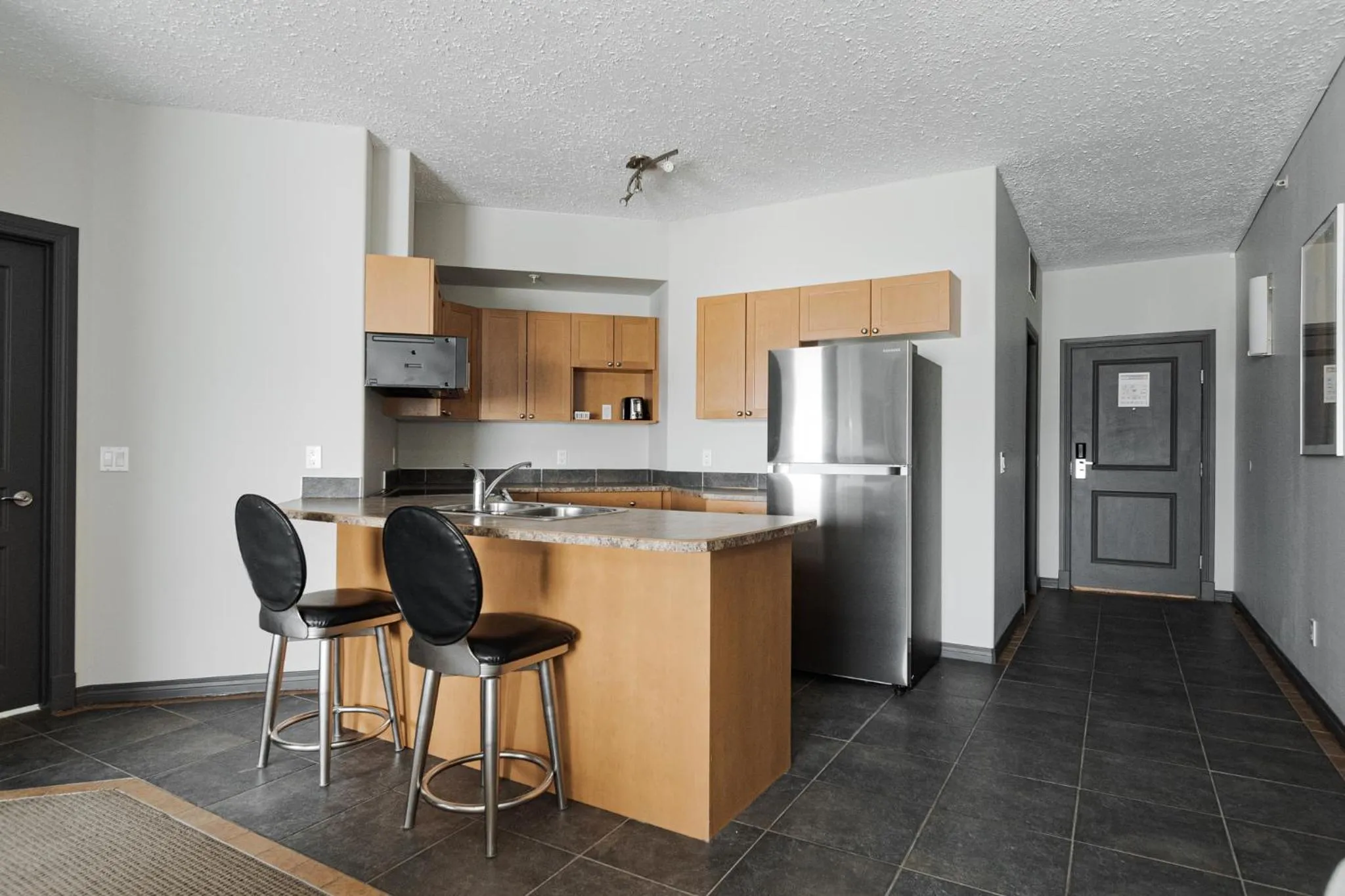 Kitchen or kitchenette in Premier Residence - Fort McMurray