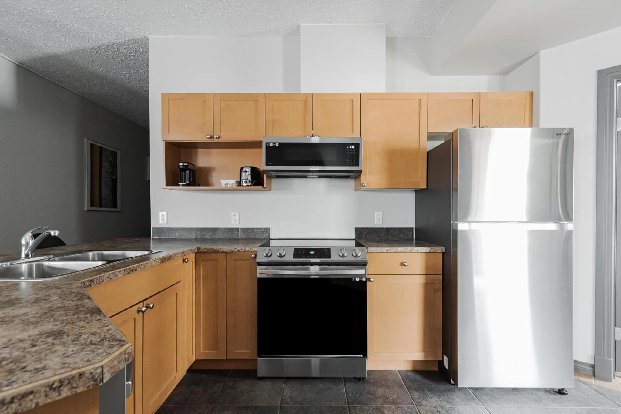 Kitchen or kitchenette in Premier Residence - Fort McMurray