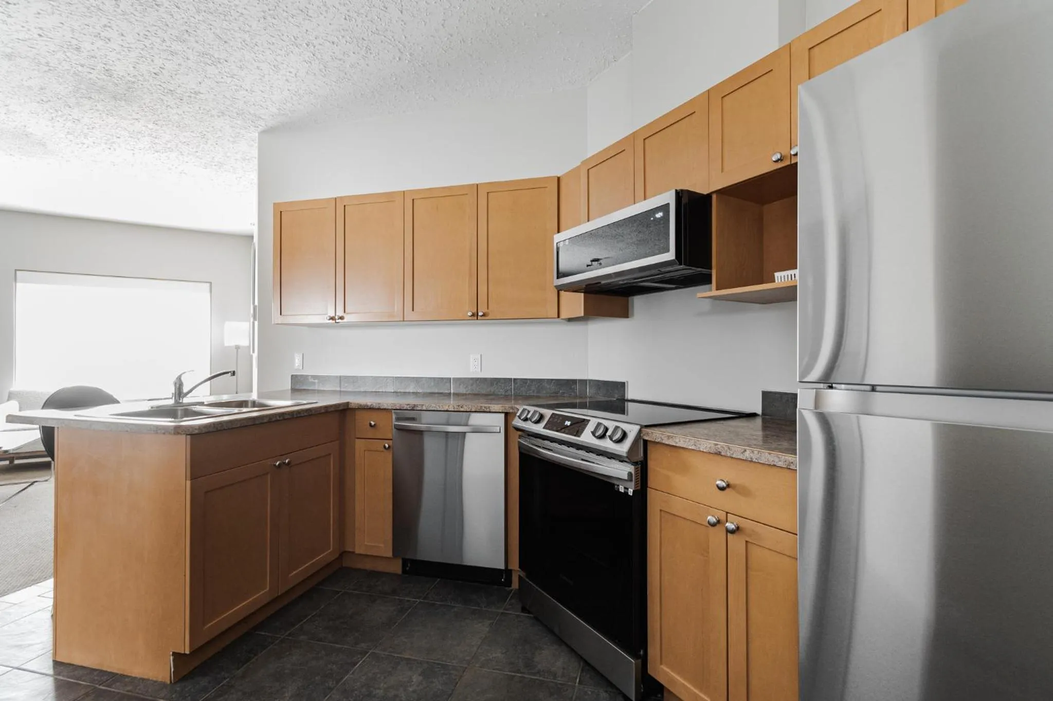 Kitchen or kitchenette in Premier Residence - Fort McMurray