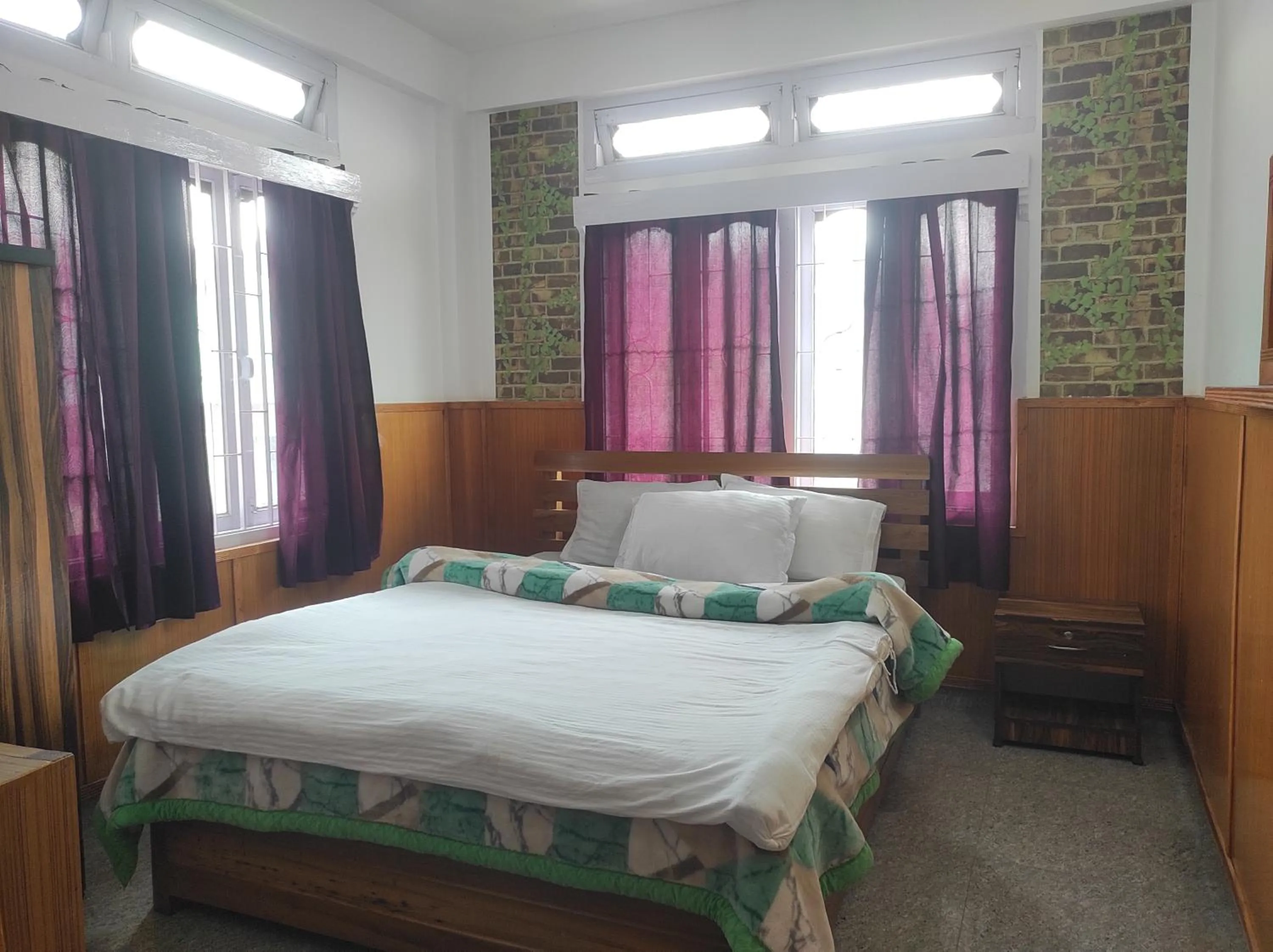 Bed in Hotel Tawang Regency