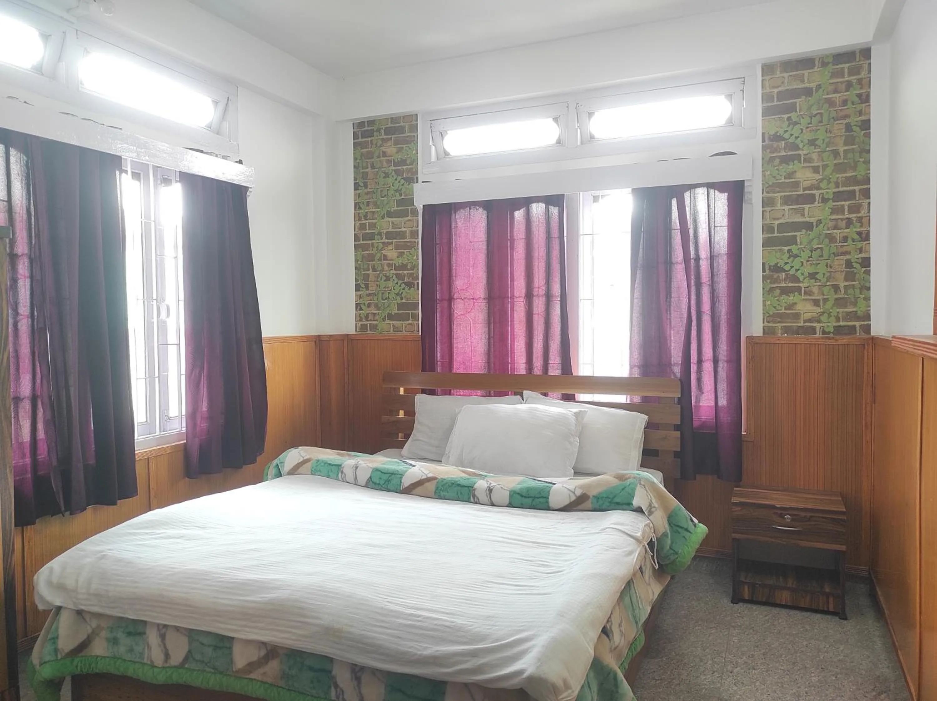 Bed in Hotel Tawang Regency
